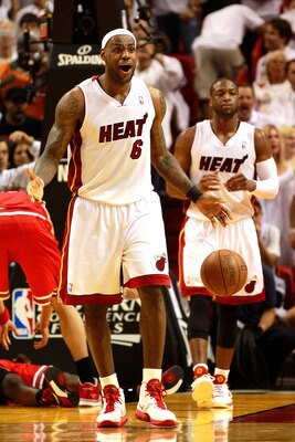 MIAMI, FL - MAY 24:  LeBron James #6 of the Miami Heat reacts against the Chicago Bulls in Game Four of the Eastern Conference Finals during the 2011 NBA Playoffs on May 24, 2011 at American Airlines Arena in Miami, Florida. Recording artist Drake NOTE TO
