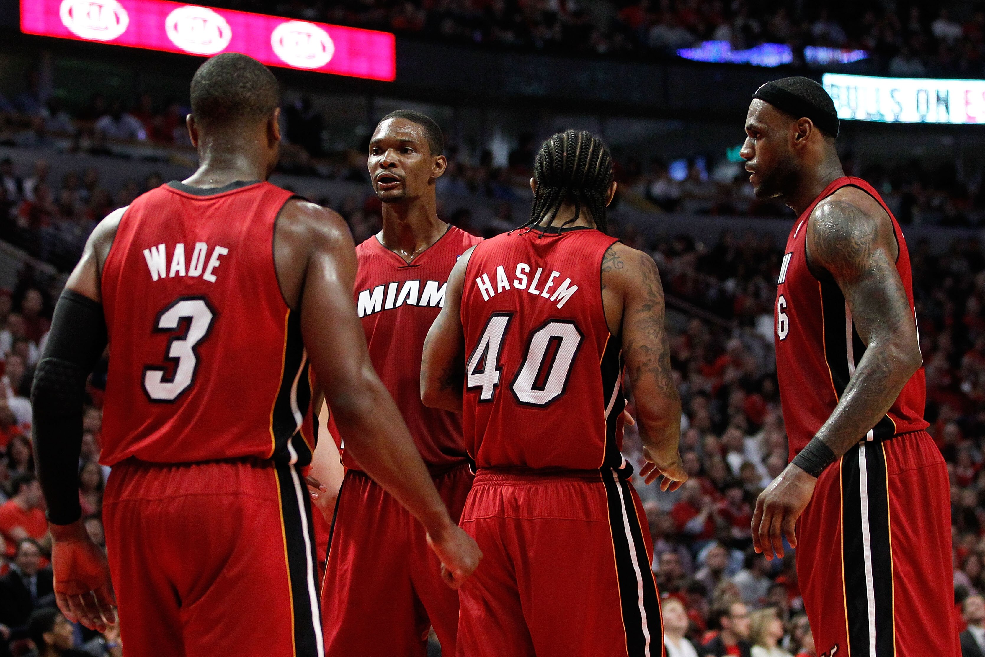CHICAGO, IL - MAY 18:  (L-R) Dwyane Wade #3, Chris Bosh #1, Udonis Haslem #40 and LeBron James #6 of the Miami Heat look on against the Chicago Bulls in Game Two of the Eastern Conference Finals during the 2011 NBA Playoffs on May 18, 2011 at the United C