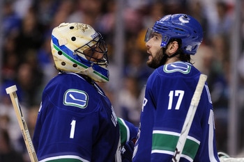 VANCOUVER, CANADA - MAY 18:  Goaltender Roberto Luongo #1 and Ryan Kesler #17 of the Vancouver Canucks confer during a break in Game Two of the Western Conference Finals against the San Jose Sharks during the 2011 Stanley Cup Playoffs at Rogers Arena on M