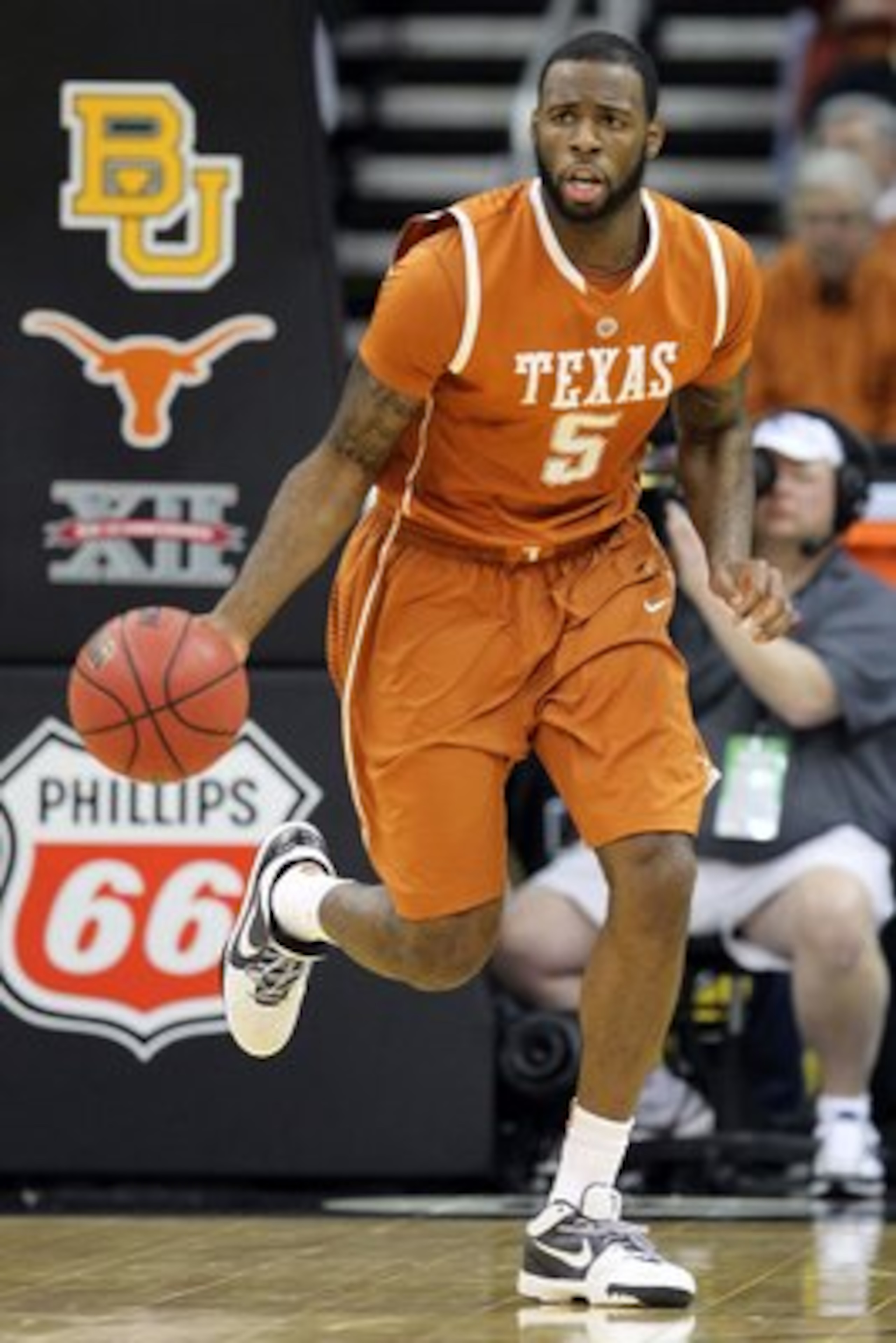 KANSAS CITY, MO - MARCH 11: Damion James #5 of the Texas Longhorns moves the ball while taking on the Baylor Bears during the quarterfinals of the 2010 Phillips 66 Big 12 Men's Basketball Tournament at the Sprint Center on March 11, 2010 in Kansas City, KANSAS CITY, MO - MARCH 11: Damion James #5 of the Texas Longhorns moves the ball while taking on the Baylor Bears during the quarterfinals of the 2010 Phillips 66 Big 12 Men's Basketball Tournament at the Sprint Center on March 11, 2010 in Kansas City,