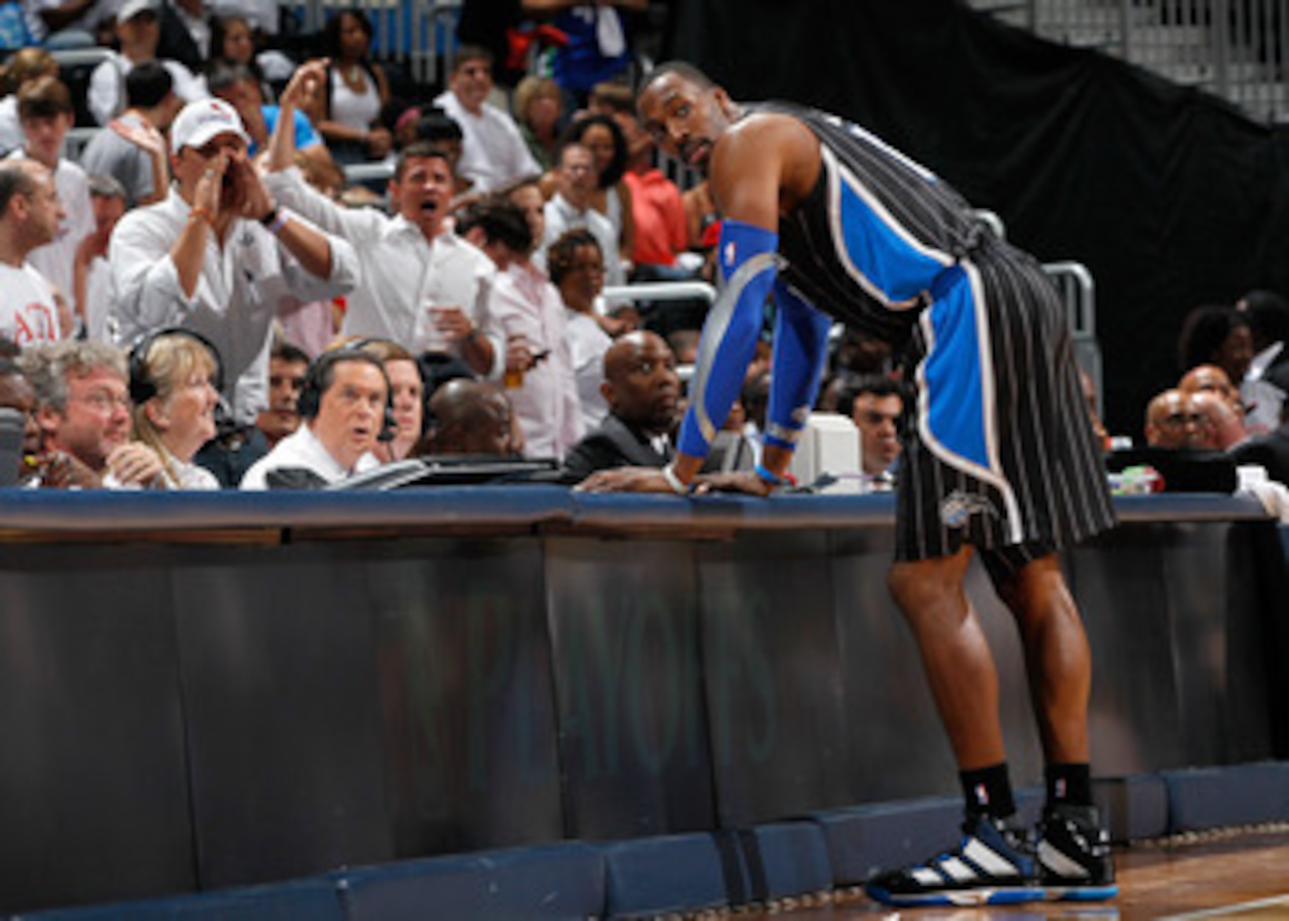 ATLANTA, GA - APRIL 28: Dwight Howard #12 of the Orlando Magic stands at the scorer's table after being earning a technical foul against Zaza Pachulia #27 of the Atlanta Hawks during Game Six of the Eastern Conference Quarterfinals in the 2011 NBA Playof ATLANTA, GA - APRIL 28: Dwight Howard #12 of the Orlando Magic stands at the scorer's table after being earning a technical foul against Zaza Pachulia #27 of the Atlanta Hawks during Game Six of the Eastern Conference Quarterfinals in the 2011 NBA Playof