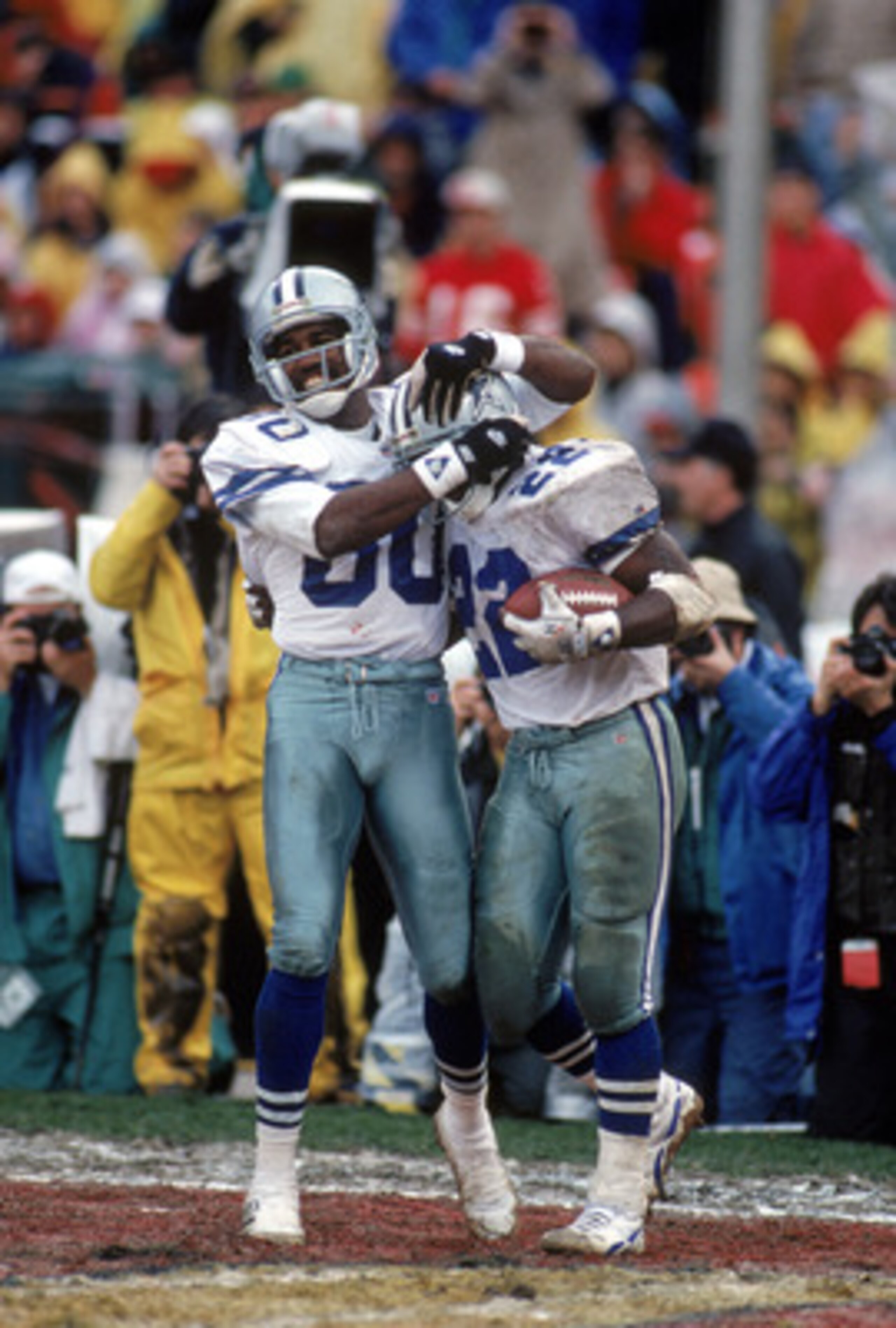 SAN FRANCISCO - JANUARY 17:  Alvin Harper #80 congratulates teammate running back Emmitt Smith #22 of the Dallas Cowboys after his rushing touchdown during the 1992 NFC Conference Championship game against the San Francisco 49ers at Candlestick Park on Ja