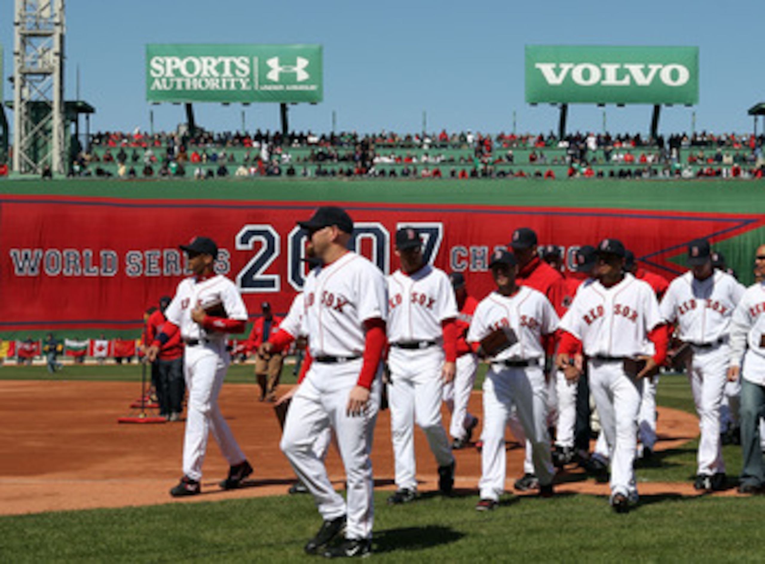 BOSTON - APRIL 08:  The Boston Red Sox  head to the dugout after raising the 2007 World Series banner and carrying their championship rings before the game against the Detroit Tigers on April 8,2008 during Opening Day at Fenway Park in Boston, Massachuset