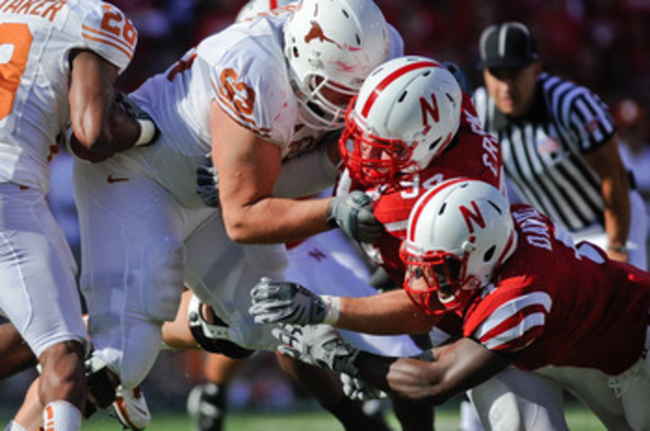 LINCOLN, NE - OCTOBER 16: Linebacker Lavonte David #4 and defensive tackle Jared Crick #94 of the Nebraska Cornhuskers attempt to get their hands on running back Foswhitt Whittaker #28 of the Texas Longhorns during first half action of their game at Memor LINCOLN, NE - OCTOBER 16: Linebacker Lavonte David #4 and defensive tackle Jared Crick #94 of the Nebraska Cornhuskers attempt to get their hands on running back Foswhitt Whittaker #28 of the Texas Longhorns during first half action of their game at Memor