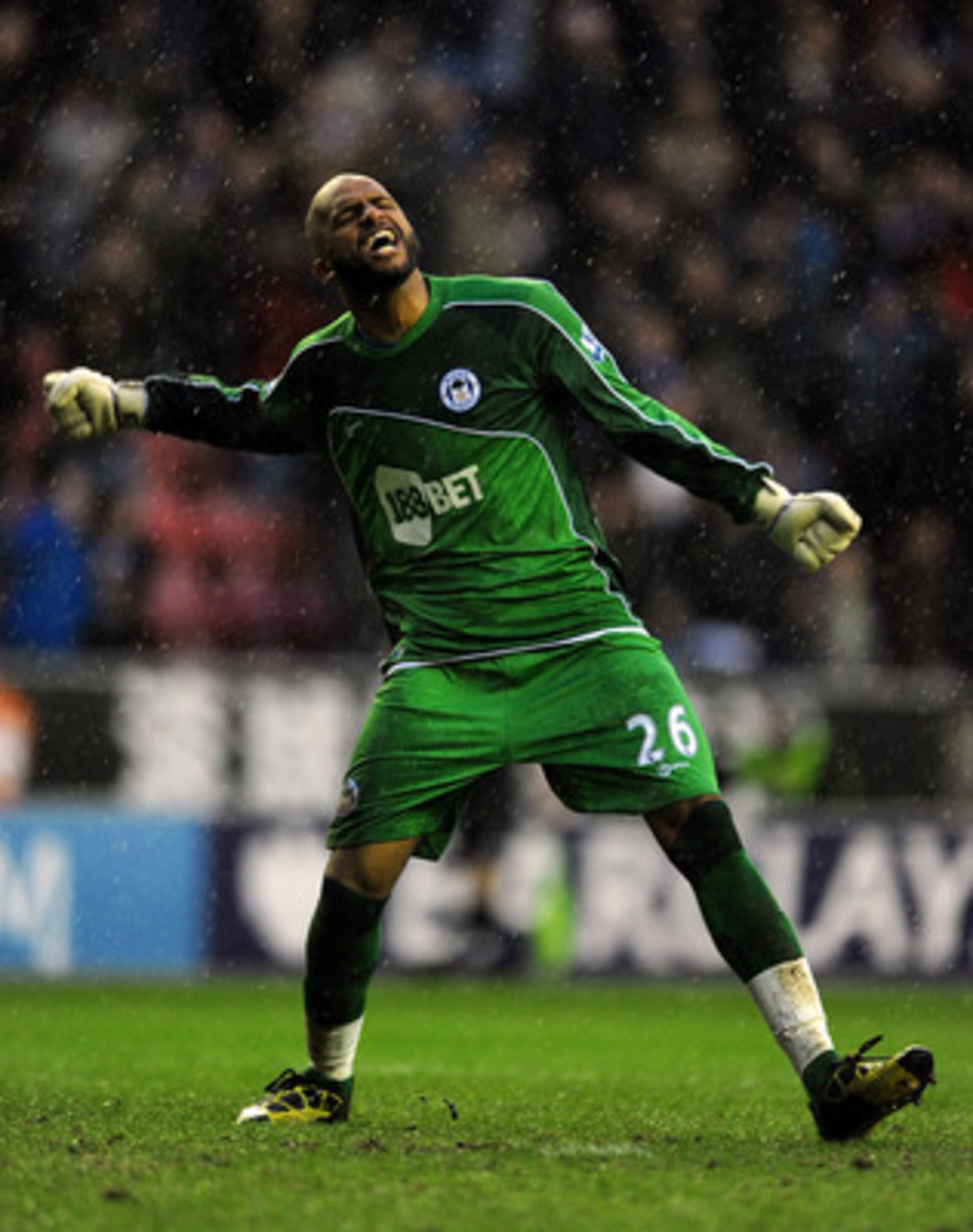 WIGAN, ENGLAND - FEBRUARY 05:  Ali Al Habsi of Wigan Athletic celebrates his side's third goal during the Barclays Premier League match between Wigan Athletic and Blackburn Rovers at DW Stadium on February 5, 2011 in Wigan, England.  (Photo by Chris Bruns
