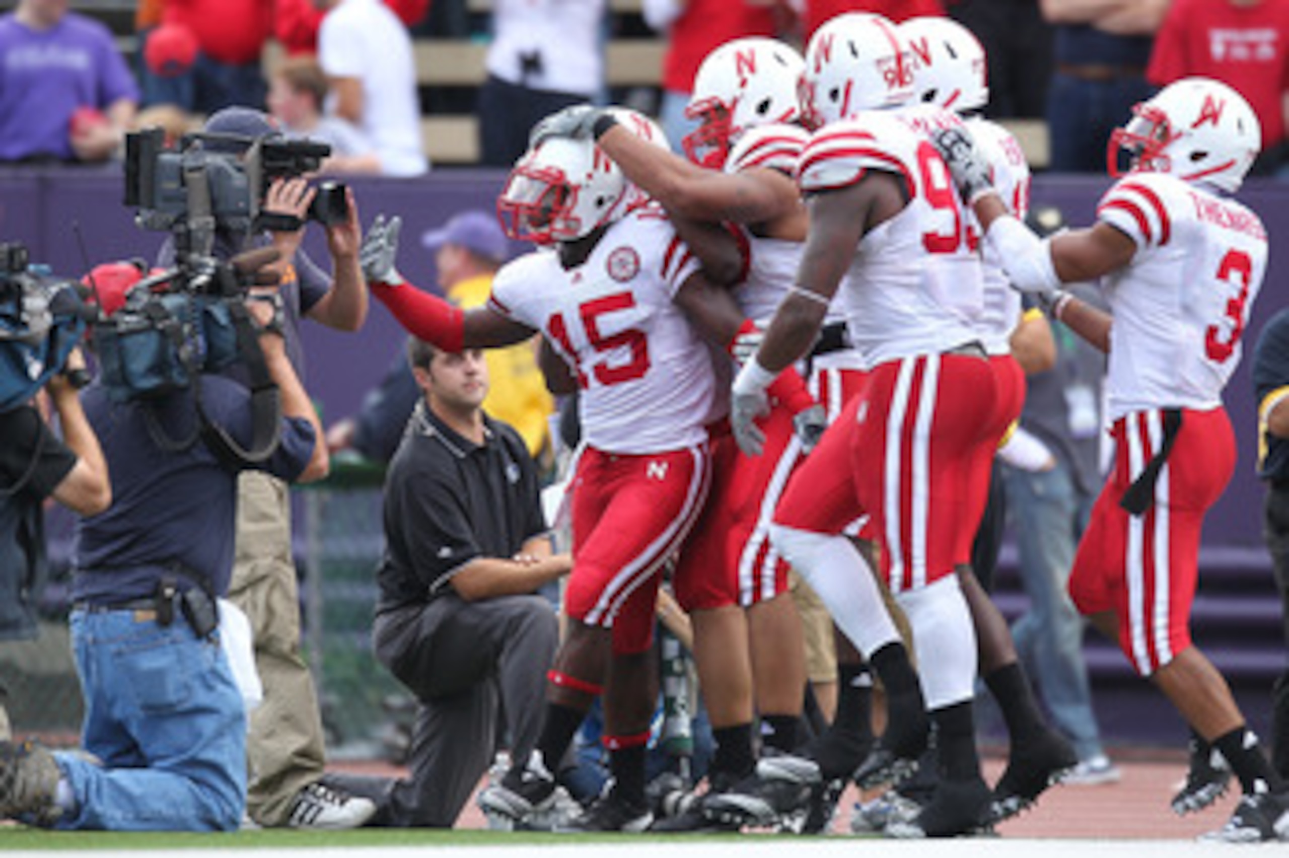 SEATTLE - SEPTEMBER 18: Cornerback Alfonzo Dennard #15 of the Nebraska Cornhuskers is mobbed by teammates after returning an interception 31 yards for a touchdown in the third quarter against the Washington Huskies on September 18, 2010 at Husky Stadium SEATTLE - SEPTEMBER 18: Cornerback Alfonzo Dennard #15 of the Nebraska Cornhuskers is mobbed by teammates after returning an interception 31 yards for a touchdown in the third quarter against the Washington Huskies on September 18, 2010 at Husky Stadium