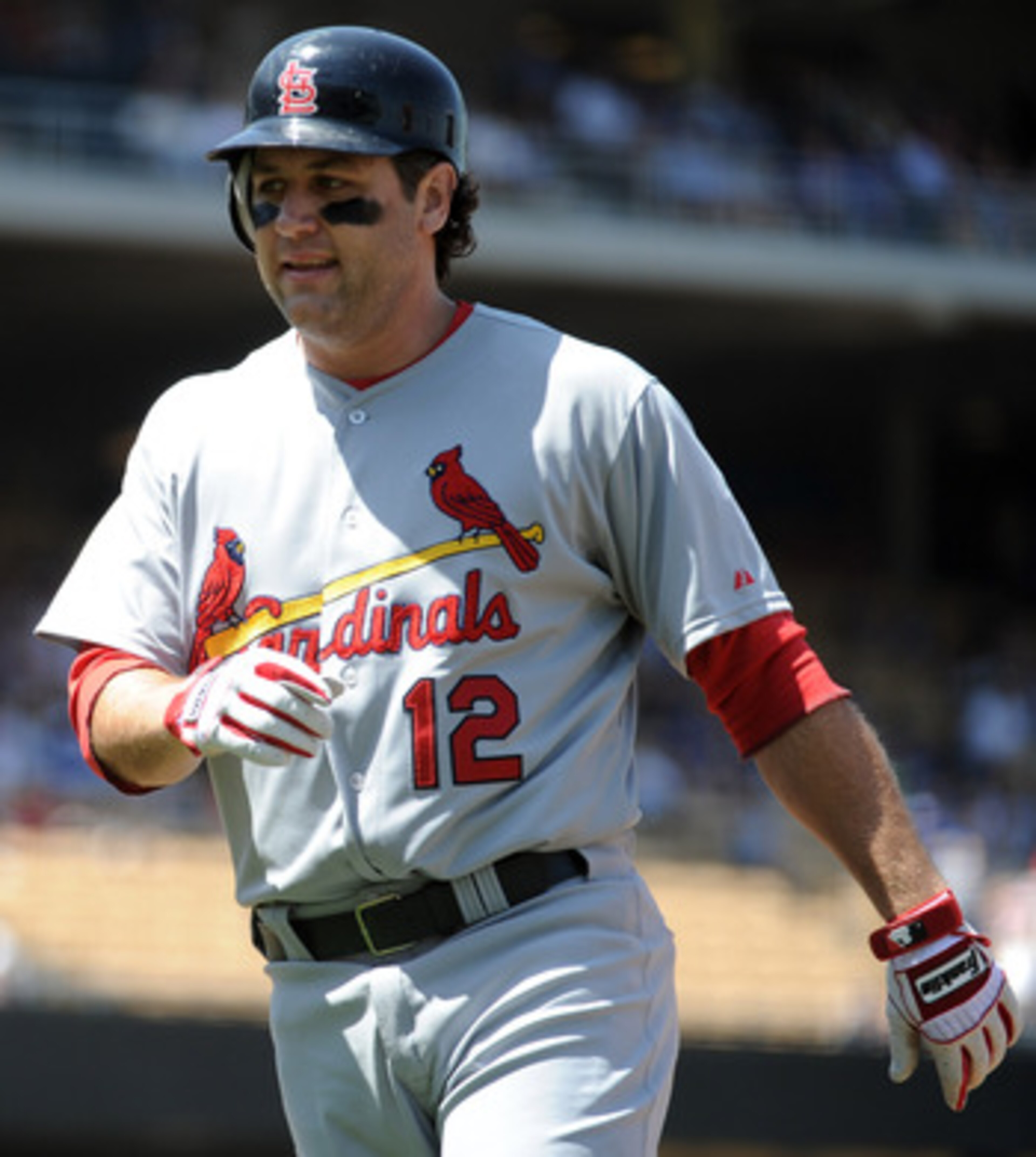 LOS ANGELES, CA - APRIL 17:  Lance Berkman #12 of the St. Louis Cardinals leaves heads to the dugout after his at bat against the Los Angeles Dodgers at Dodger Stadium on April 17, 2011 in Los Angeles, California.  (Photo by Harry How/Getty Images)