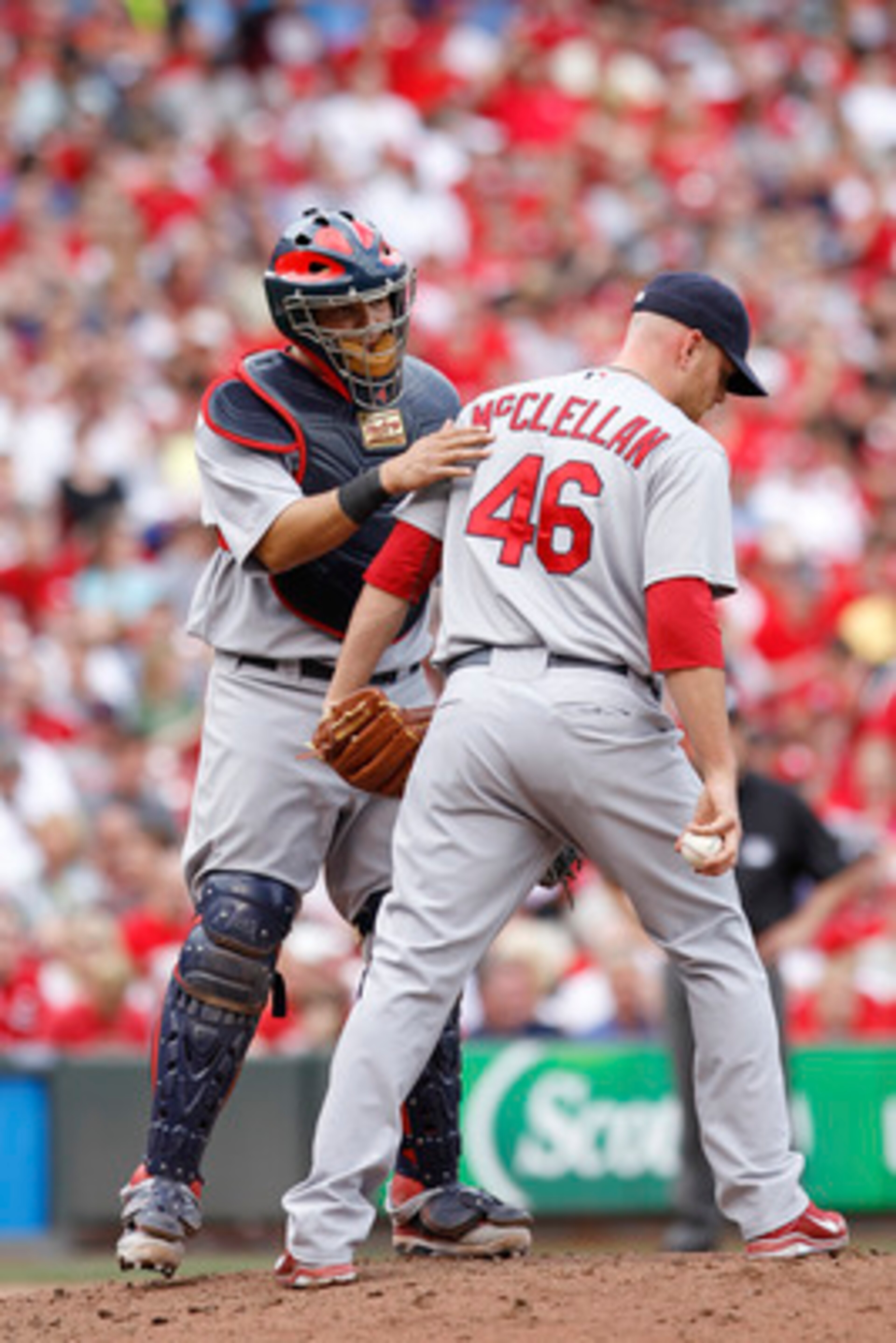 CINCINNATI, OH - MAY 14: Yadier Molina #4 of the St. Louis Cardinals talks with pitcher Kyle McClellan #46 during the game against the Cincinnati Reds at Great American Ball Park on May 14, 2011 in Cincinnati, Ohio. The Reds defeated the Cardinals 7-3. (P