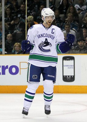 SAN JOSE, CA - MAY 22:  Henrik Sedin #33 of the Vancouver Canucks celebrates after assisting on a scoring play to teammate Alex Burrows #14 in the third period in Game Four of the Western Conference Finals against the San Jose Sharks during the 2011 Stanl