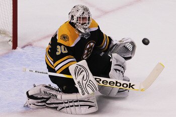 BOSTON, MA - MAY 27:  Tim Thomas #30 of the Boston Bruins makes a first period save in Game Seven of the Eastern Conference Finals against the Tampa Bay Lightning during the 2011 NHL Stanley Cup Playoffs at TD Garden on May 27, 2011 in Boston, Massachuset