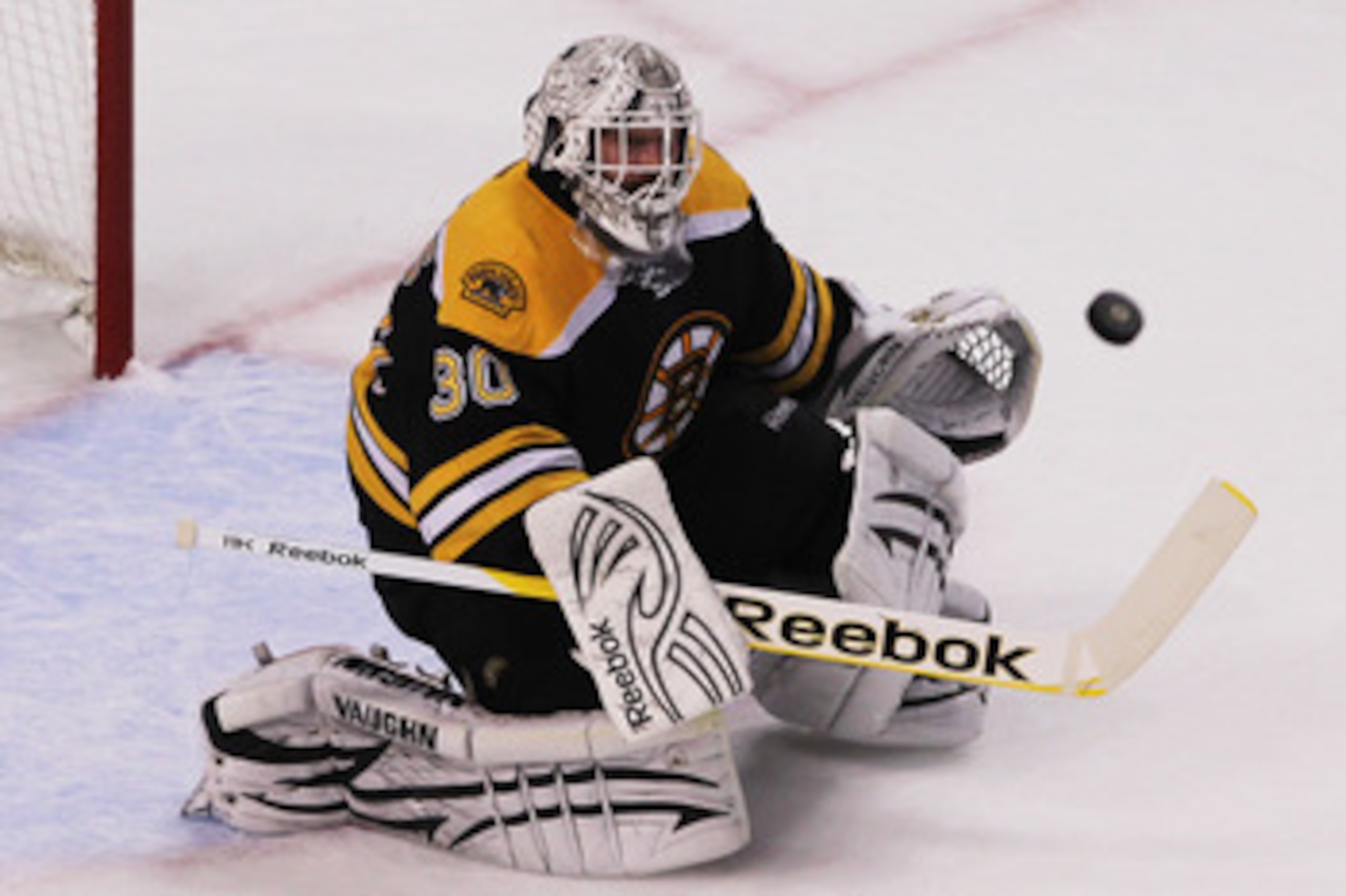BOSTON, MA - MAY 27:  Tim Thomas #30 of the Boston Bruins makes a first period save in Game Seven of the Eastern Conference Finals against the Tampa Bay Lightning during the 2011 NHL Stanley Cup Playoffs at TD Garden on May 27, 2011 in Boston, Massachuset
