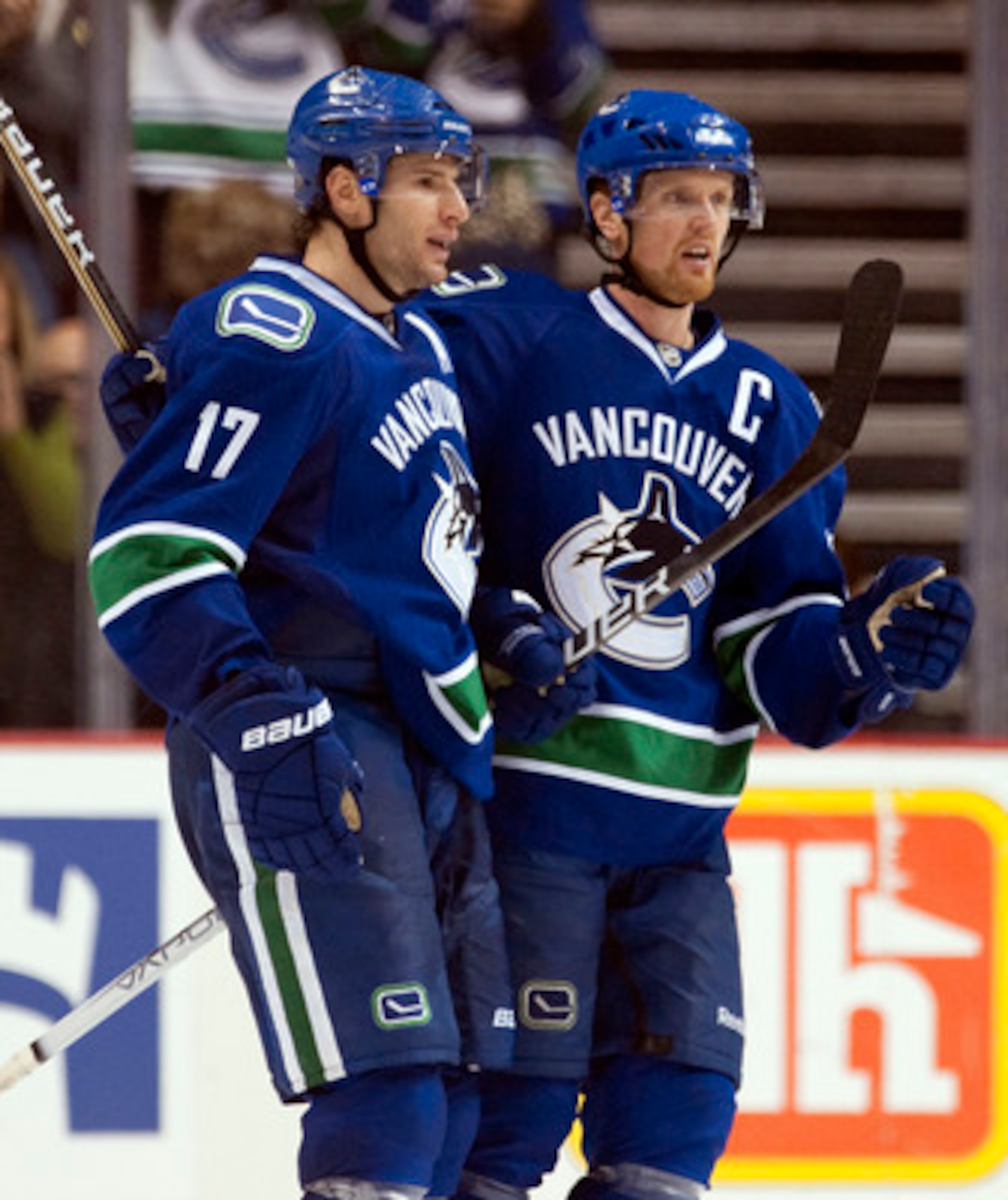 VANCOUVER, CANADA - OCTOBER 17: Ryan Kesler #17 of the Vancouver Canucks celebrates with Henrik Sedin #33 after scoring against the Carolina Hurricanes during the third period in NHL action on October 17, 2010 at Rogers Arena in Vancouver, British Columbi