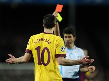 BARCELONA, SPAIN - MARCH 08:  Robin van Persie of Arsenal reacts as referee Massimo Busacca shows his a red card during the UEFA Champions League round of 16 second leg match between Barcelona and Arsenal on March 8, 2011 in Barcelona, Spain.  (Photo by J