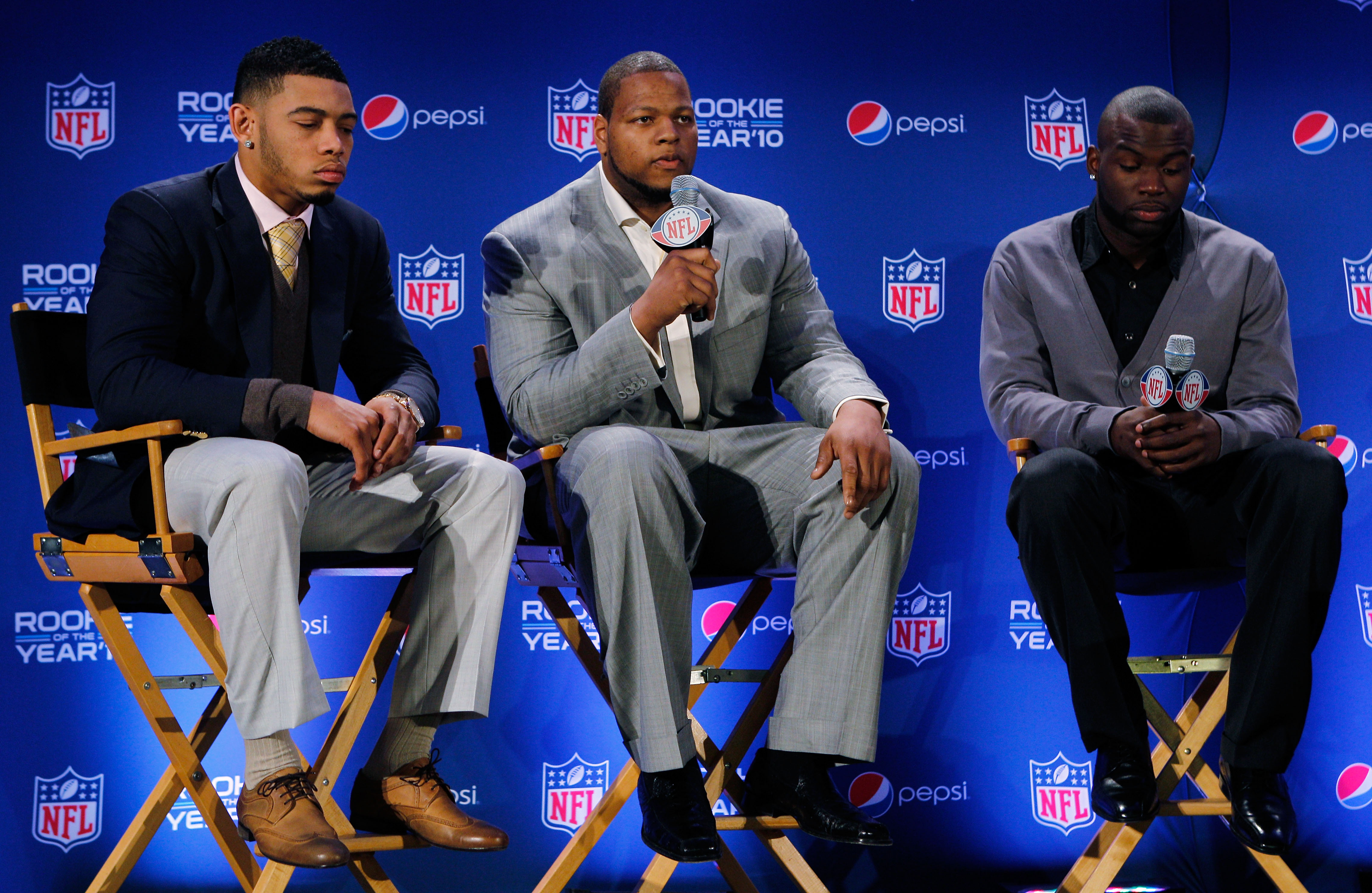 DALLAS, TX - FEBRUARY 03:  Ndamukong Suh (C) #90 of the Detroit Lions speaks as Joe Haden (L) #23 of the Cleveland Browns and Mike Williams (R) #19 of the Tampa Bay Buccaneers look on during a press conference where Suh accepted Pepsi's 2010 NFL Rookie of