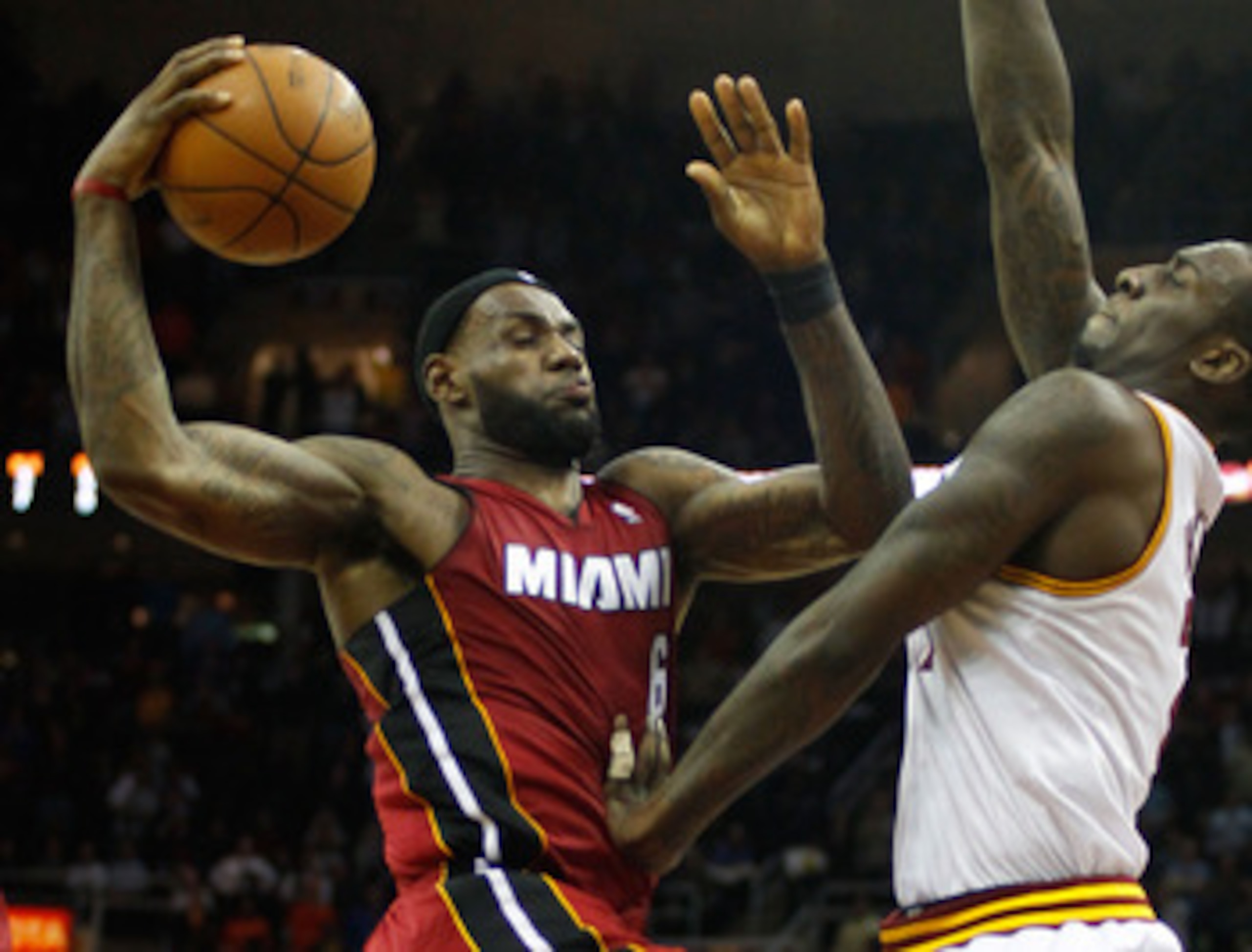 CLEVELAND - MARCH 29: LeBron James #6 of the Miami Heat drives to the basket in front of J.J. Hickson #21 of the Cleveland Cavaliers during the game on March 29, 2011 at Quicken Loans Arena in Cleveland, Ohio. NOTE TO USER: User expressly acknowledges an CLEVELAND - MARCH 29: LeBron James #6 of the Miami Heat drives to the basket in front of J.J. Hickson #21 of the Cleveland Cavaliers during the game on March 29, 2011 at Quicken Loans Arena in Cleveland, Ohio. NOTE TO USER: User expressly acknowledges an