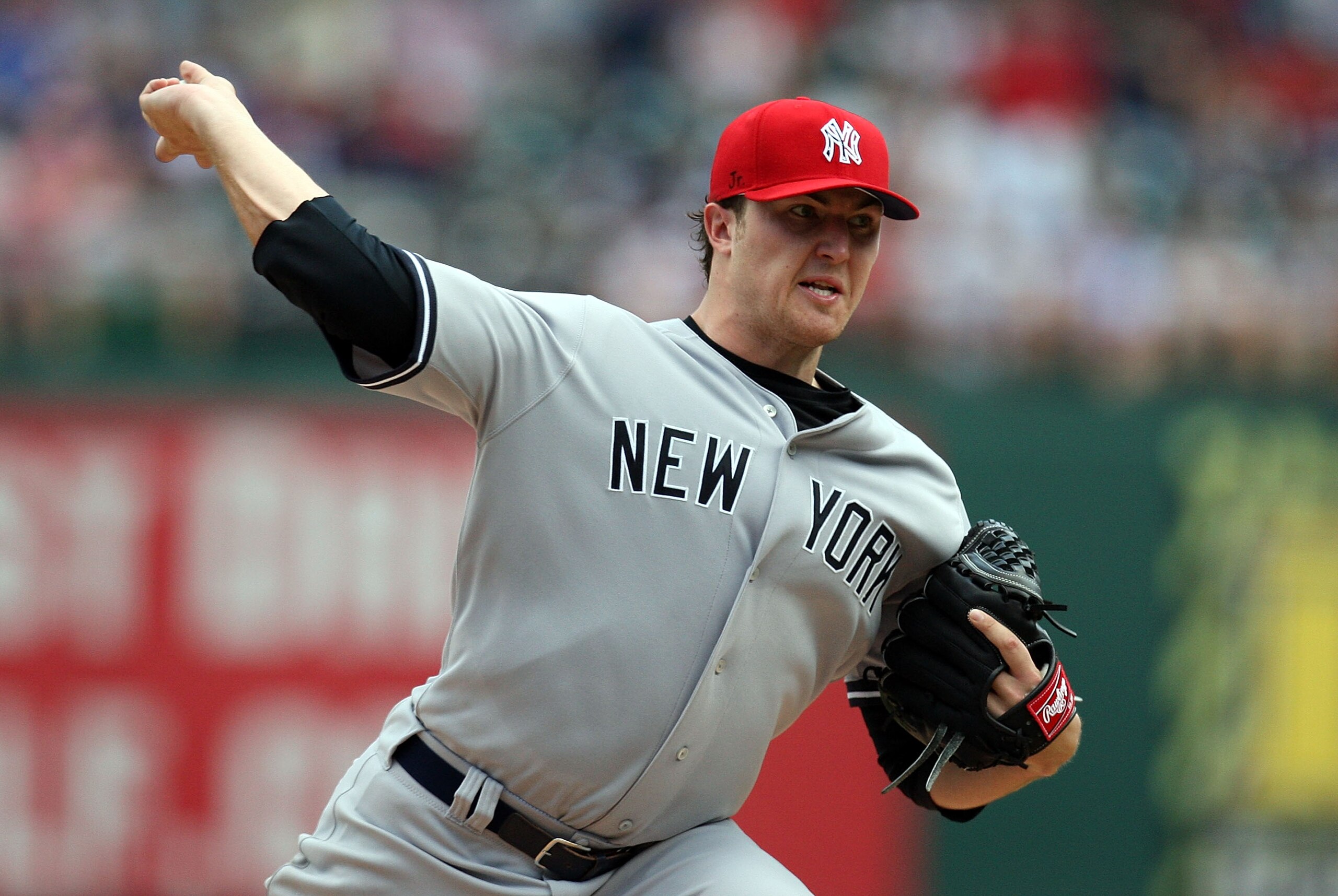 ARLINGTON, TX - MAY 25:  Pitcher Phil Hughes #65 of the New York Yankees throws against the Texas Rangers on May 25, 2009 at Rangers Ballpark in Arlington, Texas.  (Photo by Ronald Martinez/Getty Images)