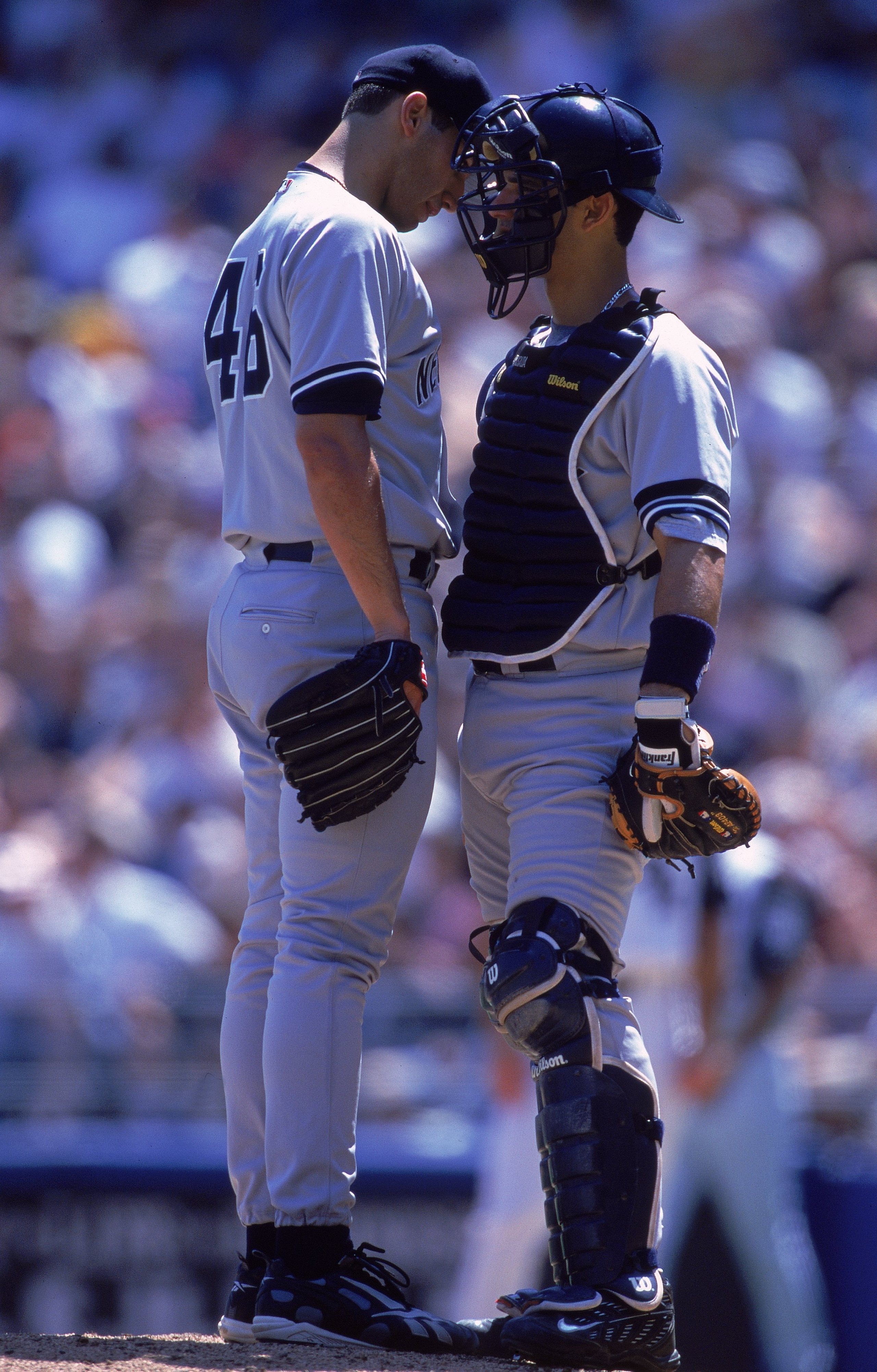 25 Jun 2000:   Pitcher Andy Pettitte #46 and Catcher Jorge Posada #20 of the New York Yankees talk at the pitcher's mound during the game against the Chicago White Sox at Comiskey Park in Chicago, Illinois. The White Sox defeated the Yankees 8-7. Mandator