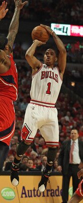 CHICAGO, IL - MAY 10: Derrick Rose #1 of the Chicago Bulls puts up a shot against Josh Smith #5 of the Atlanta Hawks in Game Five of the Eastern Conference Semifinals in the 2011 NBA Playoffs at the United Center on May 10, 2011 in Chicago, Illinois. The