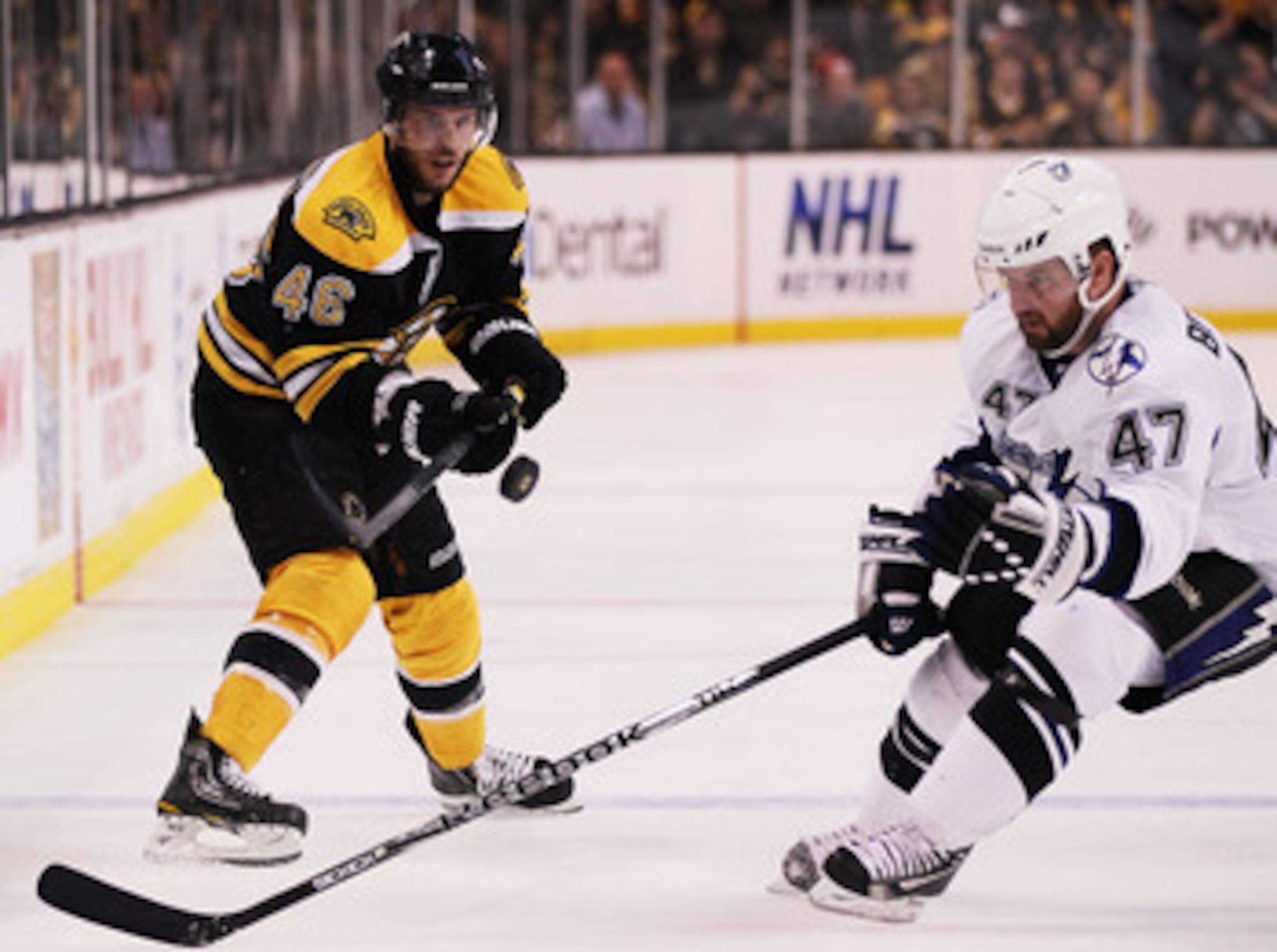 BOSTON, MA - MAY 23:  David Krejci #46 of the Boston Bruins and Marc-Andre Bergeron #47 of the Tampa Bay Lightning vie for the puck in Game Five of the Eastern Conference Finals during the 2011 NHL Stanley Cup Playoffs at TD Garden on May 23, 2011 in Bost
