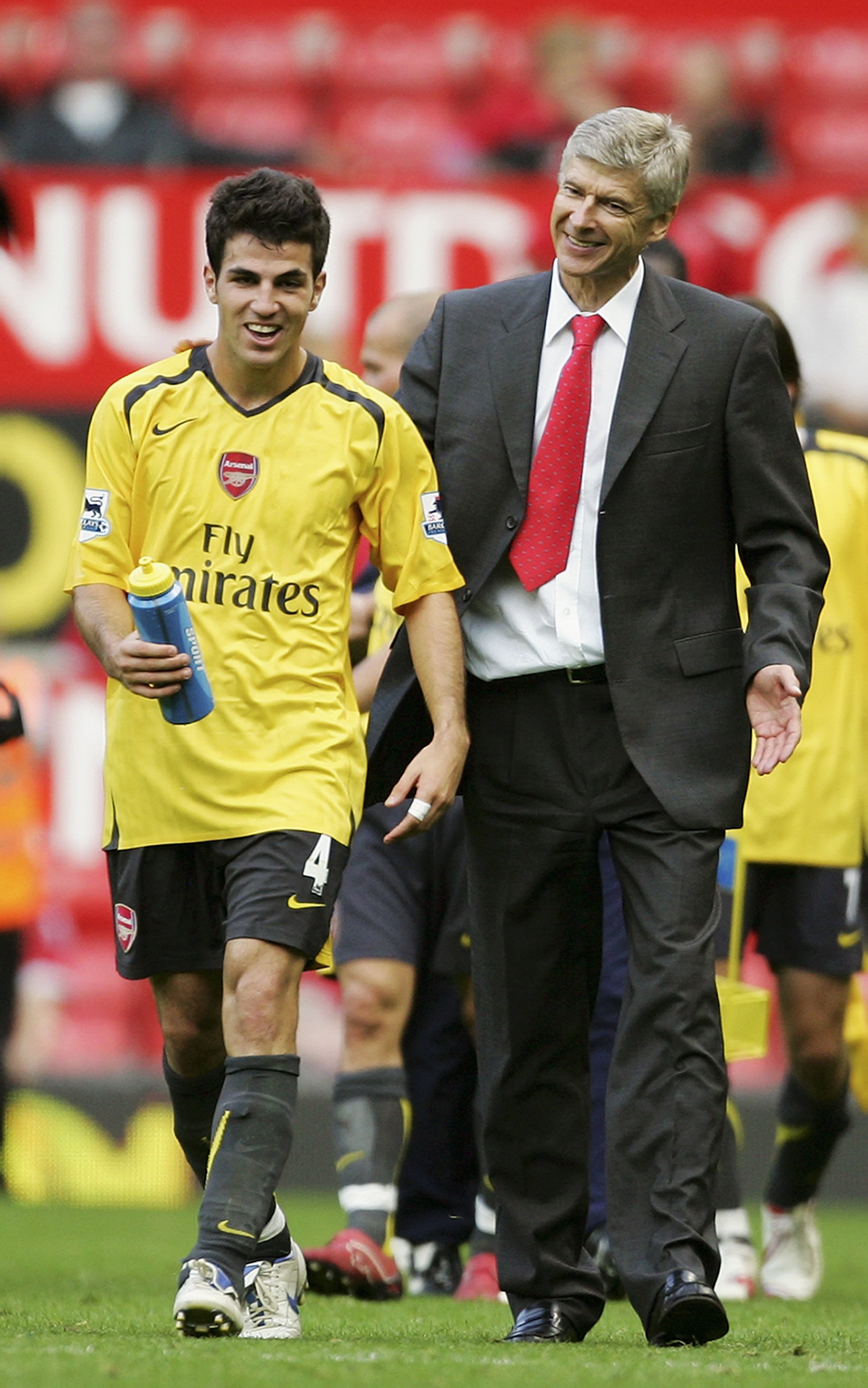 MANCHESTER, UNITED KINGDOM - SEPTEMBER 17:  Arsene Wenger (R) , the Arsenal manager congratulates Cesc Fabregas, following their team's 1-0 victory during the Barclays Premiership match between Manchester United and Arsenal at Old Trafford on September 17