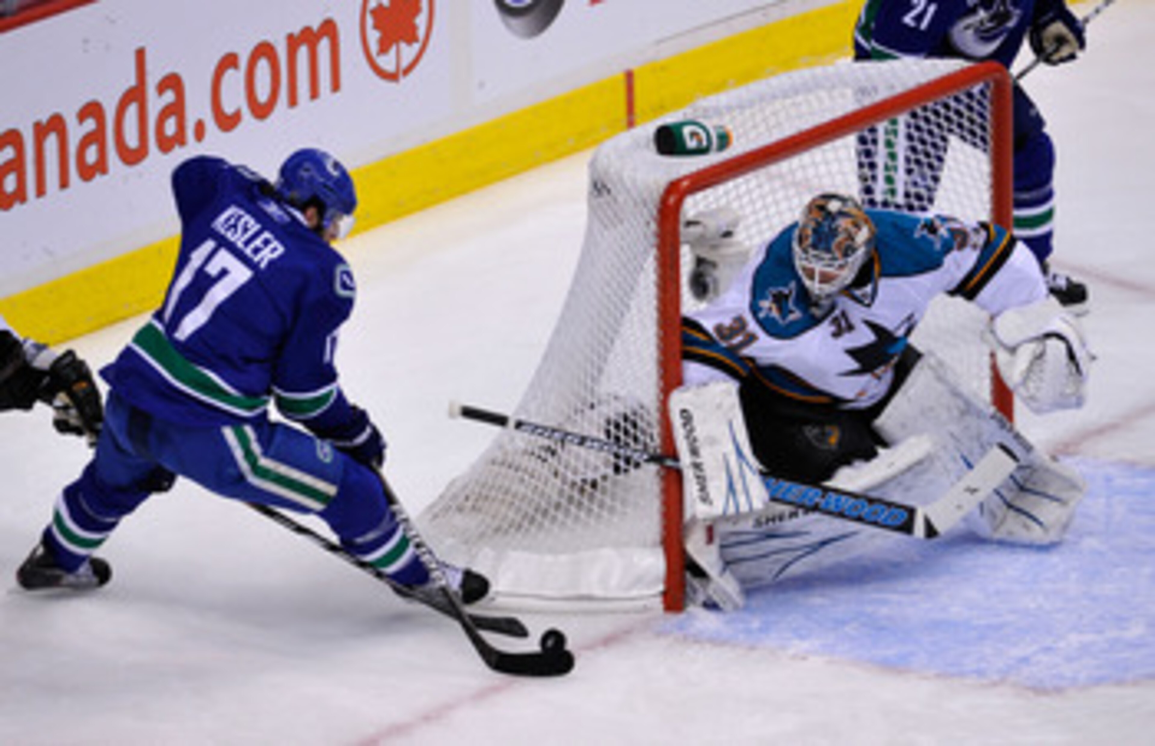 VANCOUVER, CANADA - MAY 24:  Ryan Kesler #17 of the Vancouver Canucks skates in for the short-side stuff-in attempt past Antti Niemi #31 of the San Jose Sharks in the first period in Game Five of the Western Conference Finals during the 2011 Stanley Cup P