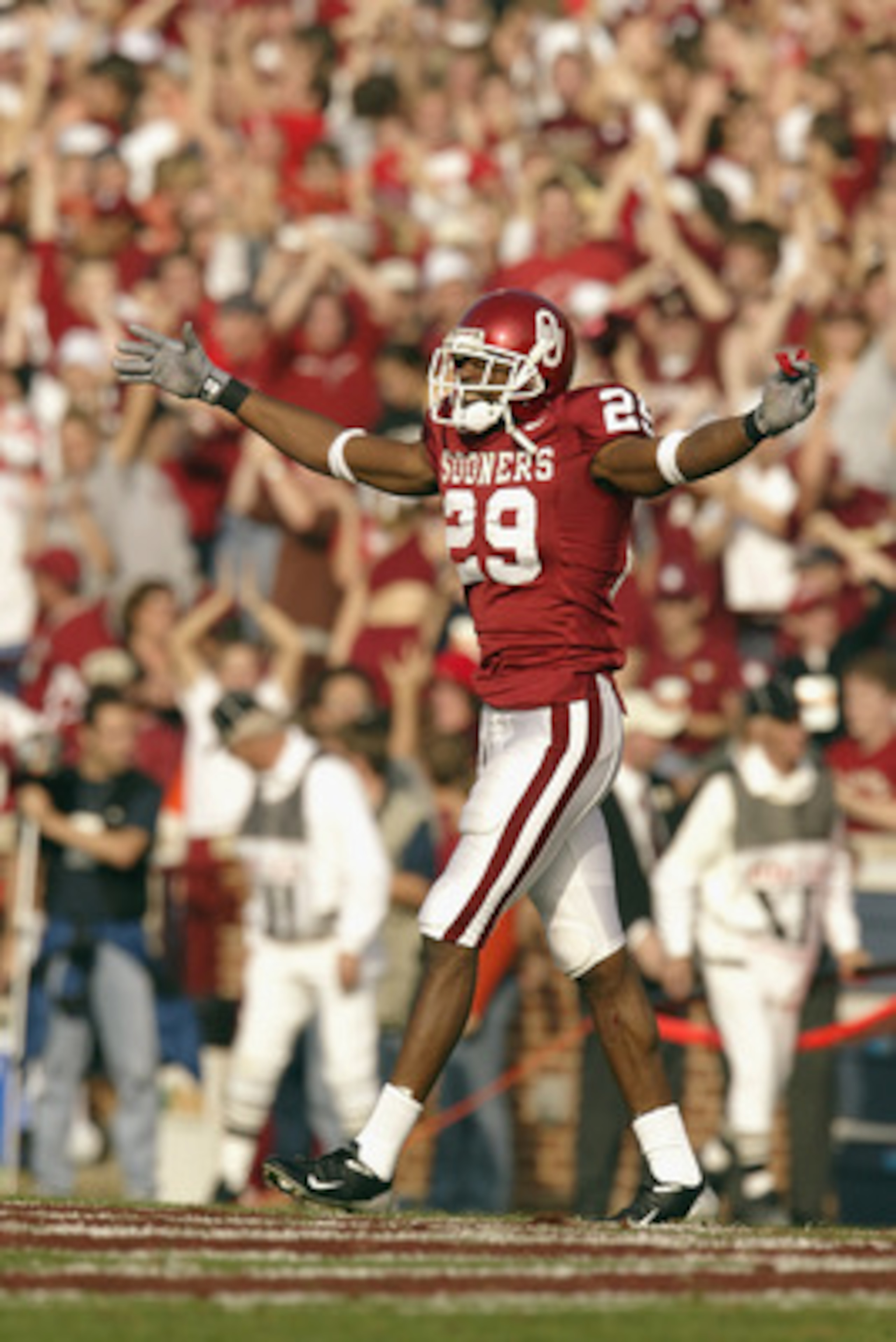 NORMAN, OK - NOVEMBER 1:  Wide receiver Will Peoples #29 of the Oklahoma Sooners pumps up the home crowd during the game against the Oklahoma State Cowboys on November 1, 2003 at Memorial Stadium in Norman, Oklahoma. Oklahoma defeated Oklahoma State 52-9.
