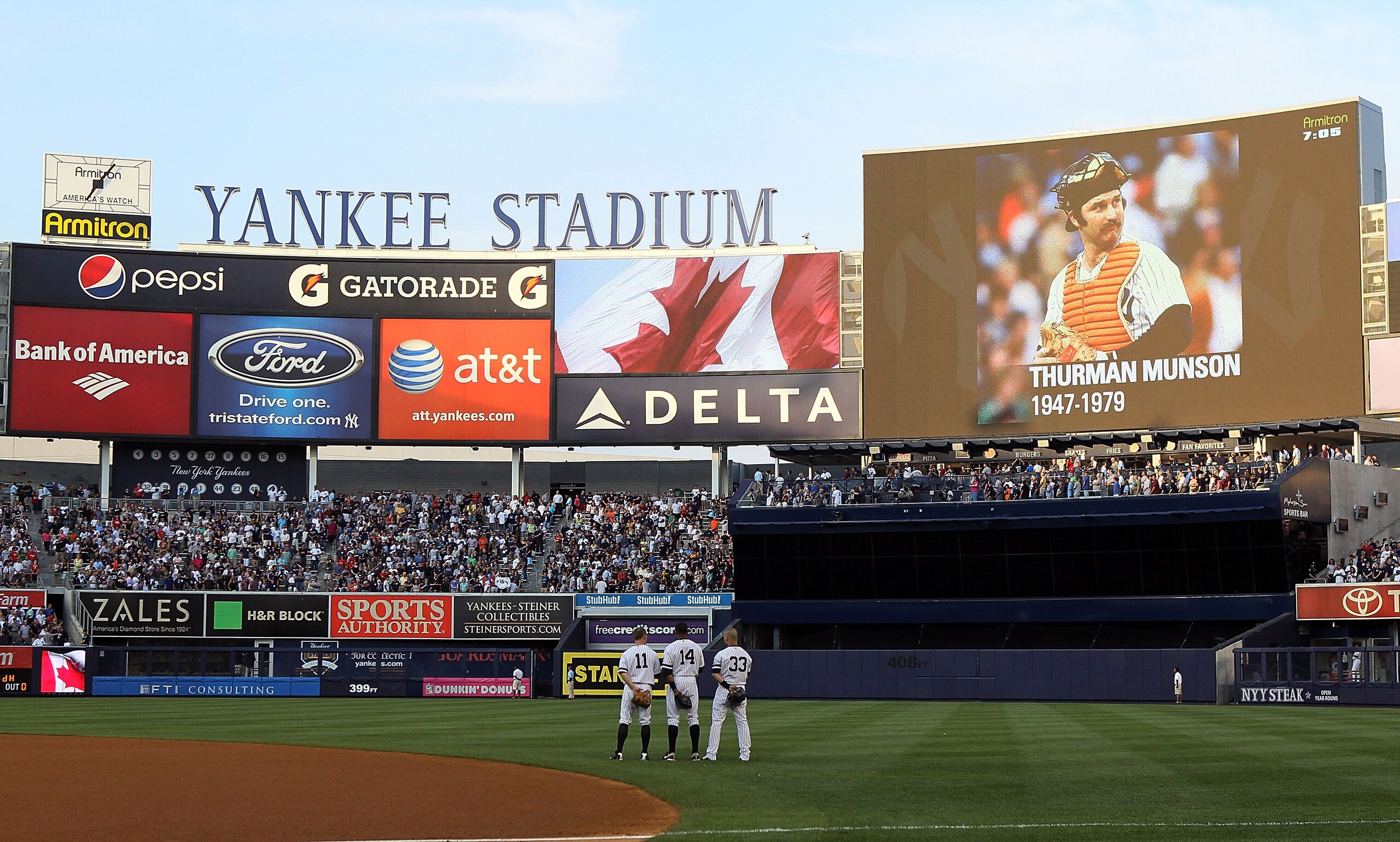 NEW YORK - AUGUST 02:  (L-R) Brett Gardner #11, Curtris Granderson #14, and Nick Swisher #33 of the New York Yankees stand for a moment of silence for former captain Thurman Munson who passed away 31 years ago prior to playing against the Toronto Blue Jay