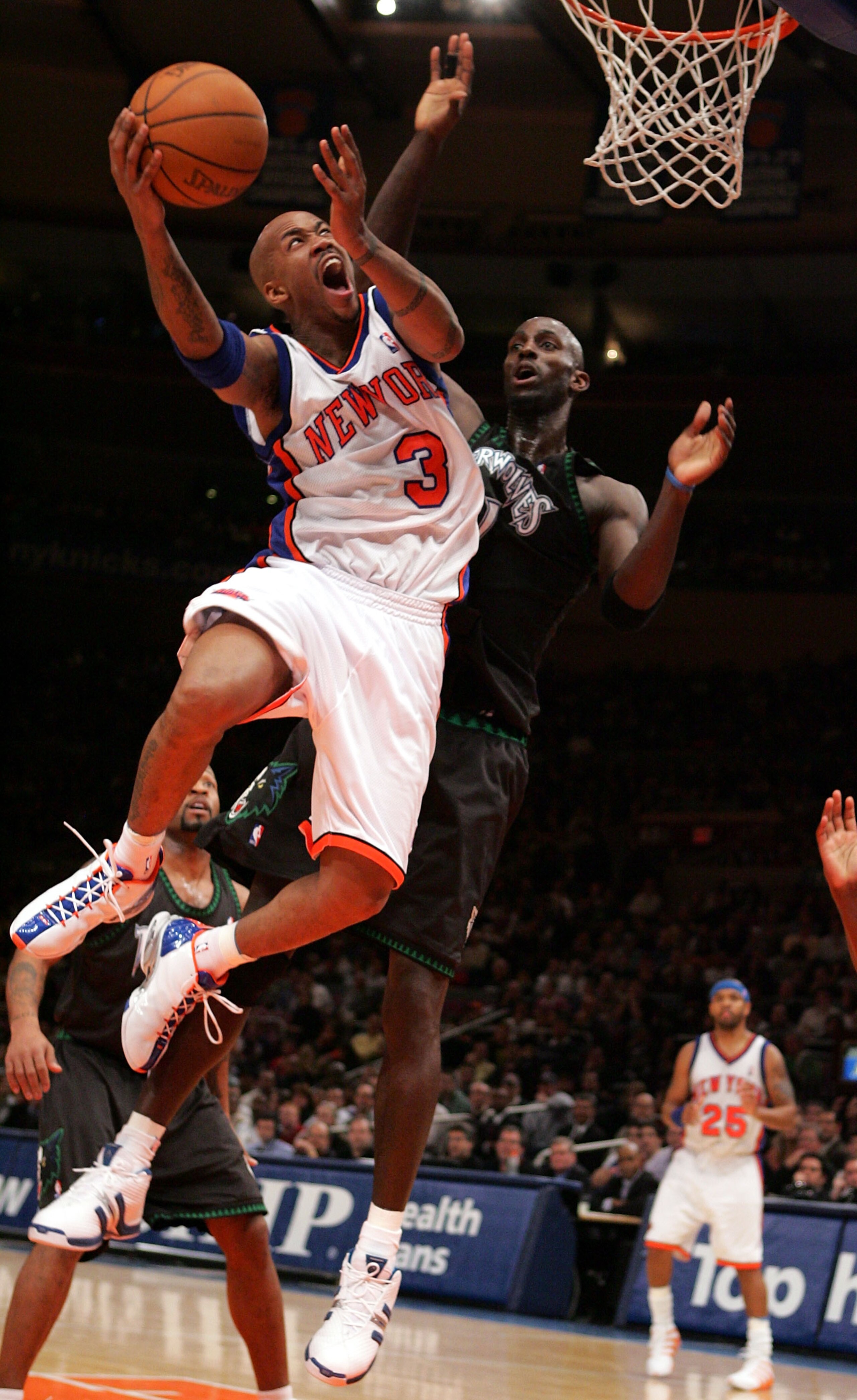 NEW YORK - DECEMBER 29: Stephon Marbury #3 of the New York Knicks prepares to dunk against Kevin Garnett #21 of the Minnesota Timberwolves during thier game on December 29, 2004 at Madison Square Garden in New York City.  NOTE TO USER:  User expressly ack