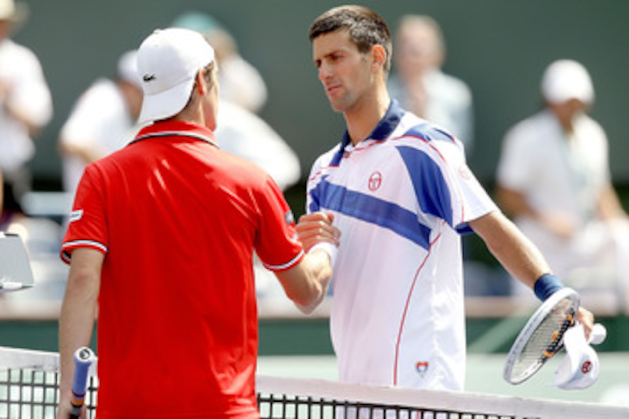 INDIAN WELLS, CA - MARCH 18:  Richard Gasquet of France congratulates Novak Djokovic of Serbia after their match during the BNP Paribas Open at the Indian Wells Tennis Garden on March 18, 2011 in Indian Wells, California.  (Photo by Matthew Stockman/Getty