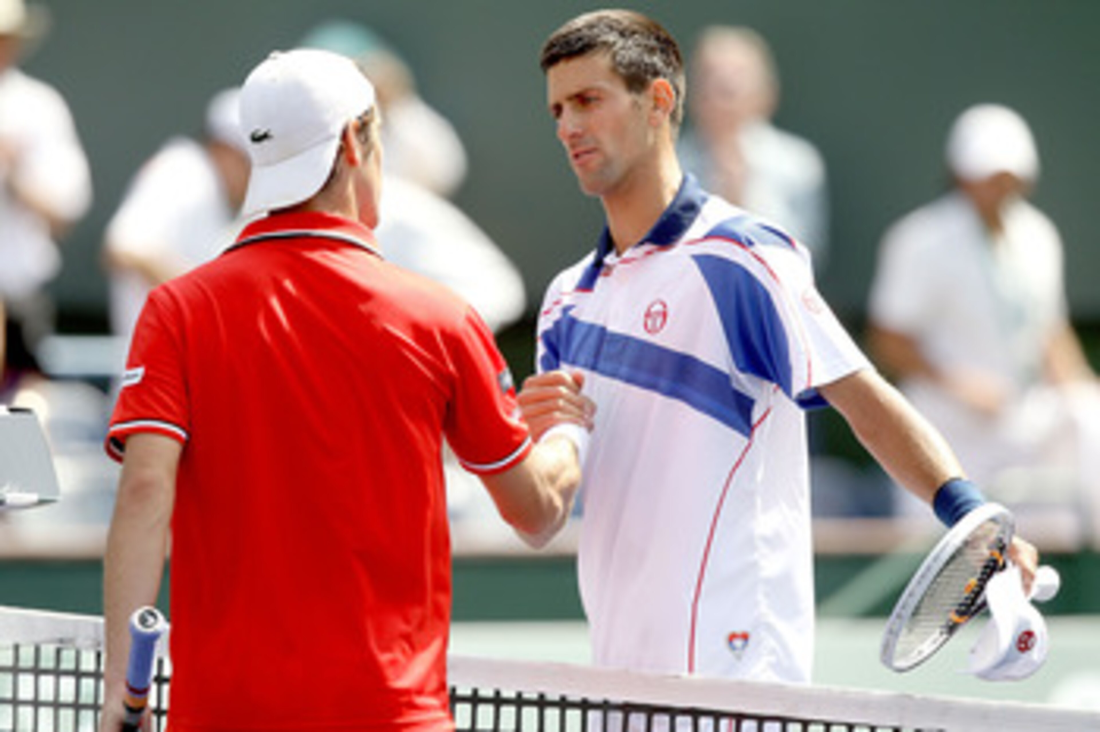 INDIAN WELLS, CA - MARCH 18:  Richard Gasquet of France congratulates Novak Djokovic of Serbia after their match during the BNP Paribas Open at the Indian Wells Tennis Garden on March 18, 2011 in Indian Wells, California.  (Photo by Matthew Stockman/Getty