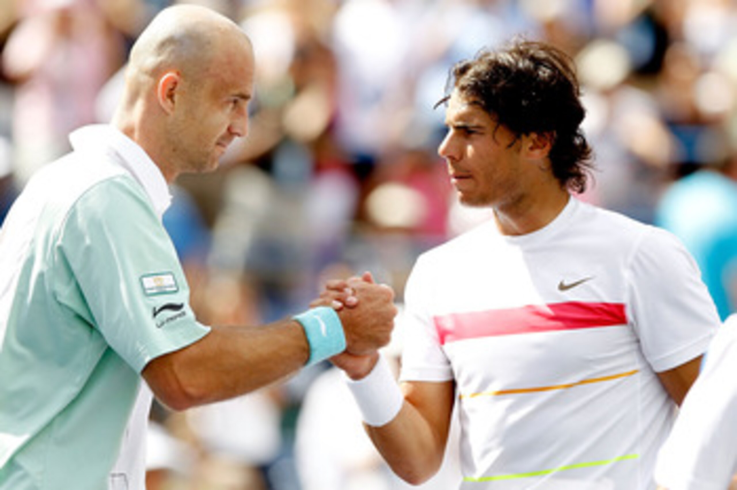 INDIAN WELLS, CA - MARCH 20:  Ivan Ljubicic (L) of Croatia is congratulated at the net by Rafael Nadal of Spain after their match during the semifinals of the BNP Paribas Open on March 20, 2010 at the Indian Wells Tennis Garden in Indian Wells, California