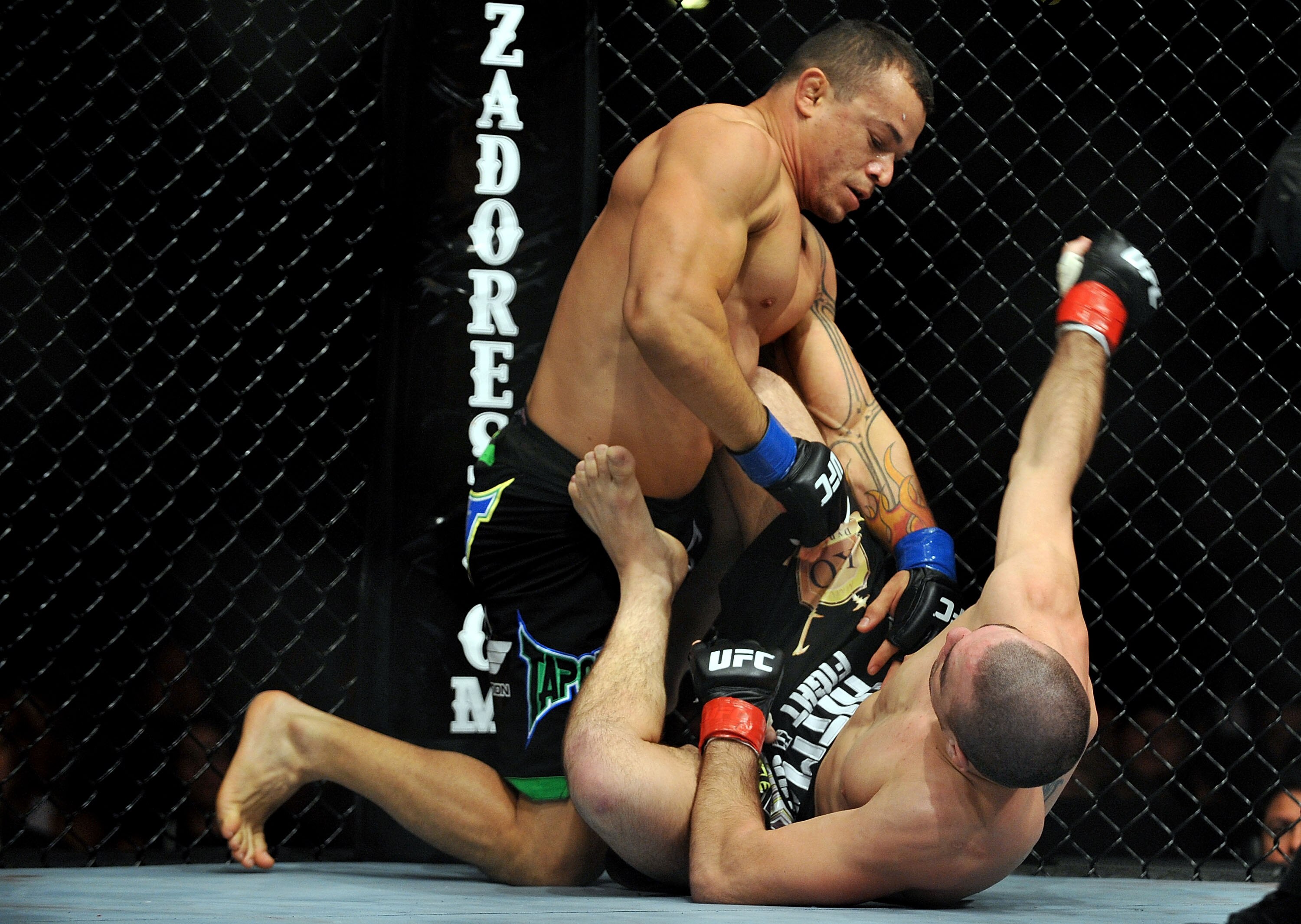 LOS ANGELES, CA - OCTOBER 24:  UFC fighter Gleison Tibau (top) battles with UFC fighter Josh Neer during their Lightweight 'Swing' bout at UFC 104: Machida vs. Shogun at Staples Center on October 24, 2009 in Los Angeles, California.  (Photo by Jon Kopalof