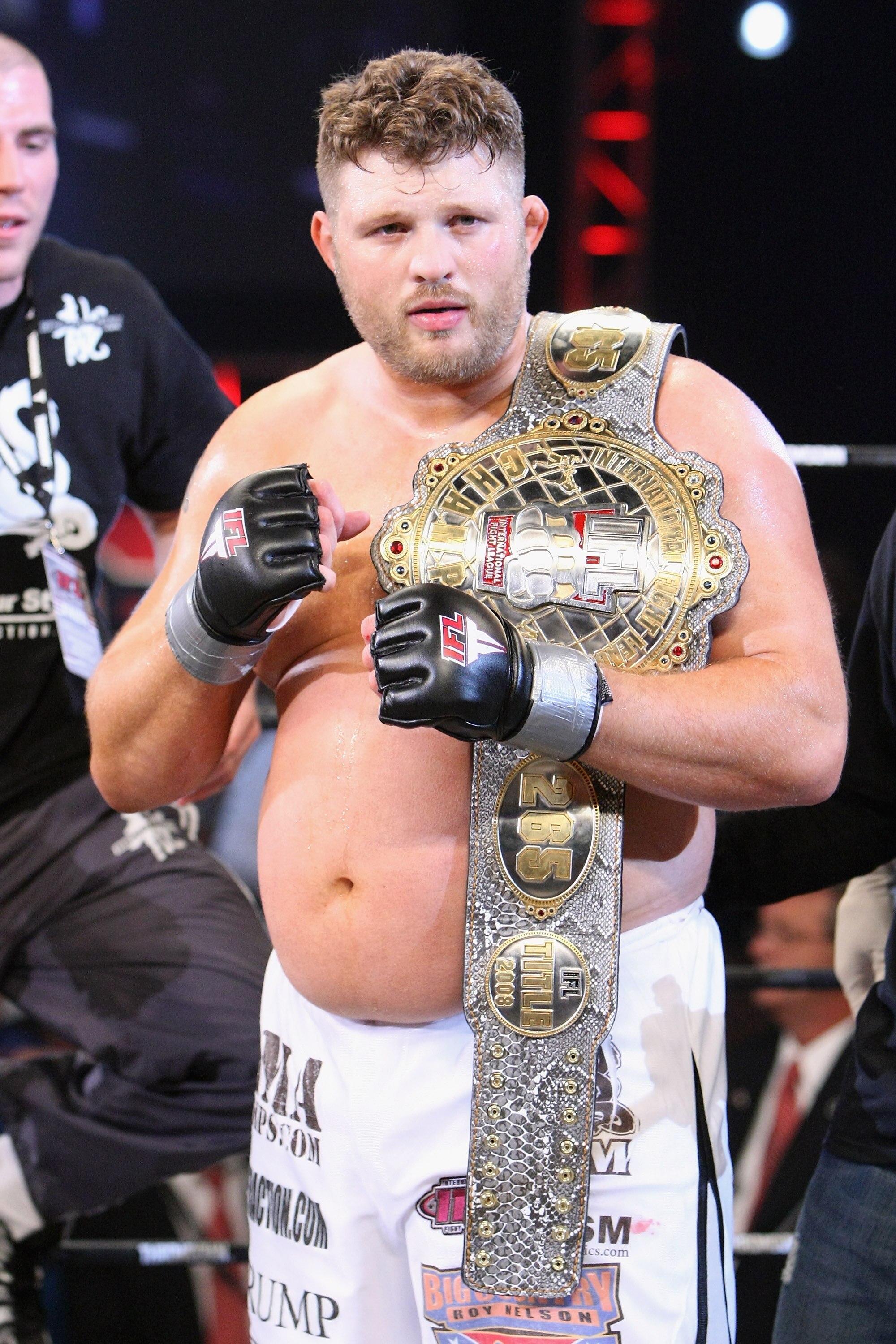 UNCASVILLE, CT - MAY 16:  Roy Nelson (White Trunks) of the Lions Den celebrates after beating Brad Imes of the MilesTech Fighting System during their bout presented by the International Fighting League at the Mohegan Sun Arena May 16, 2008 in Uncasville,