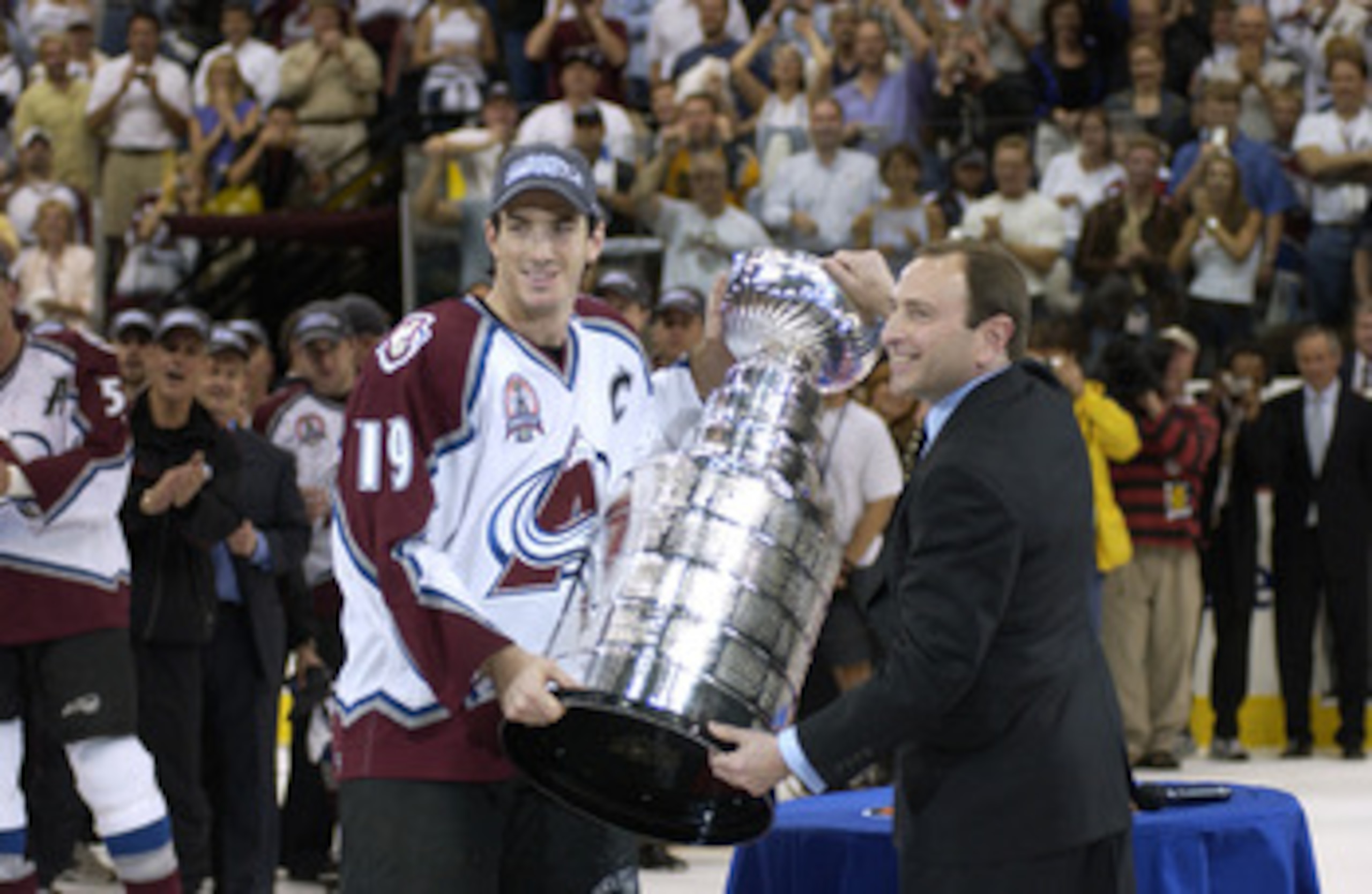 9 Jun 2001: Joe Sakic #19 of the Colorado Avalanche and commissioner Gary Bettman hold the Stanley Cup after the Avalanche defeated the New Jersey Devils in game seven of the Stanley Cup finals at the Pepsi Center in Denver, Colorado. DIGITAL IMAGE Mandat