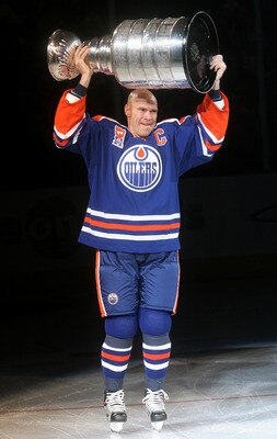 EDMONTON, CANADA - FEBRUARY 27:  Former Edmonton Oilers great Mark Messier #11 hoists the Stanley Cup while skating across the ice during a ceremony to raise his #11 banner to the rafters of Rexall Place prior to the Oilers game against the Phoenix Coyote