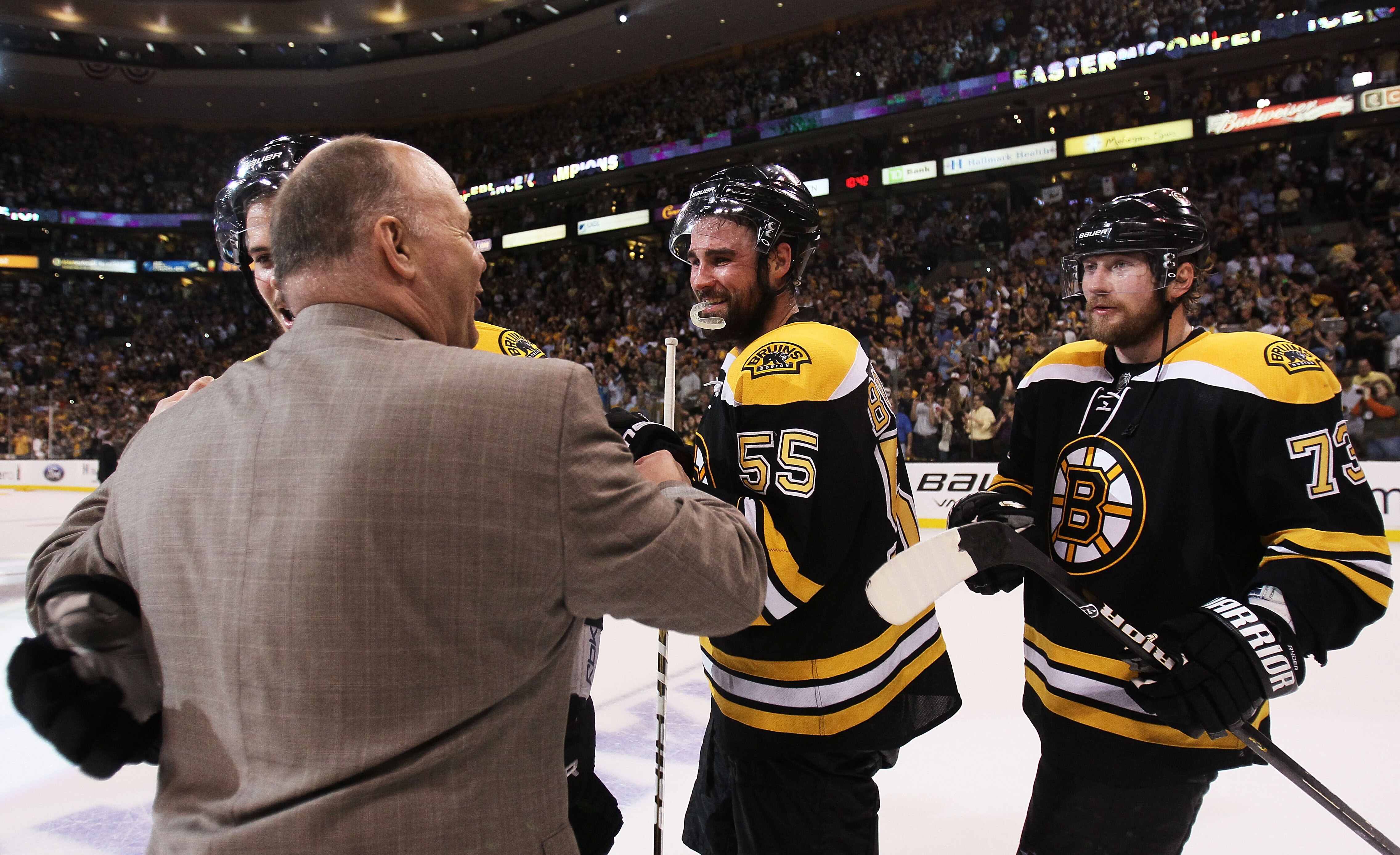 BOSTON, MA - MAY 27:  Head coach Claude Julien celebrates with Adam McQuaid #54, Johnny Boychuk #55 and Michael Ryder #73 of the Boston Bruins after they defeated the Tampa Bay Lightning 1 to 0 in Game Seven of the Eastern Conference Finals during the 201