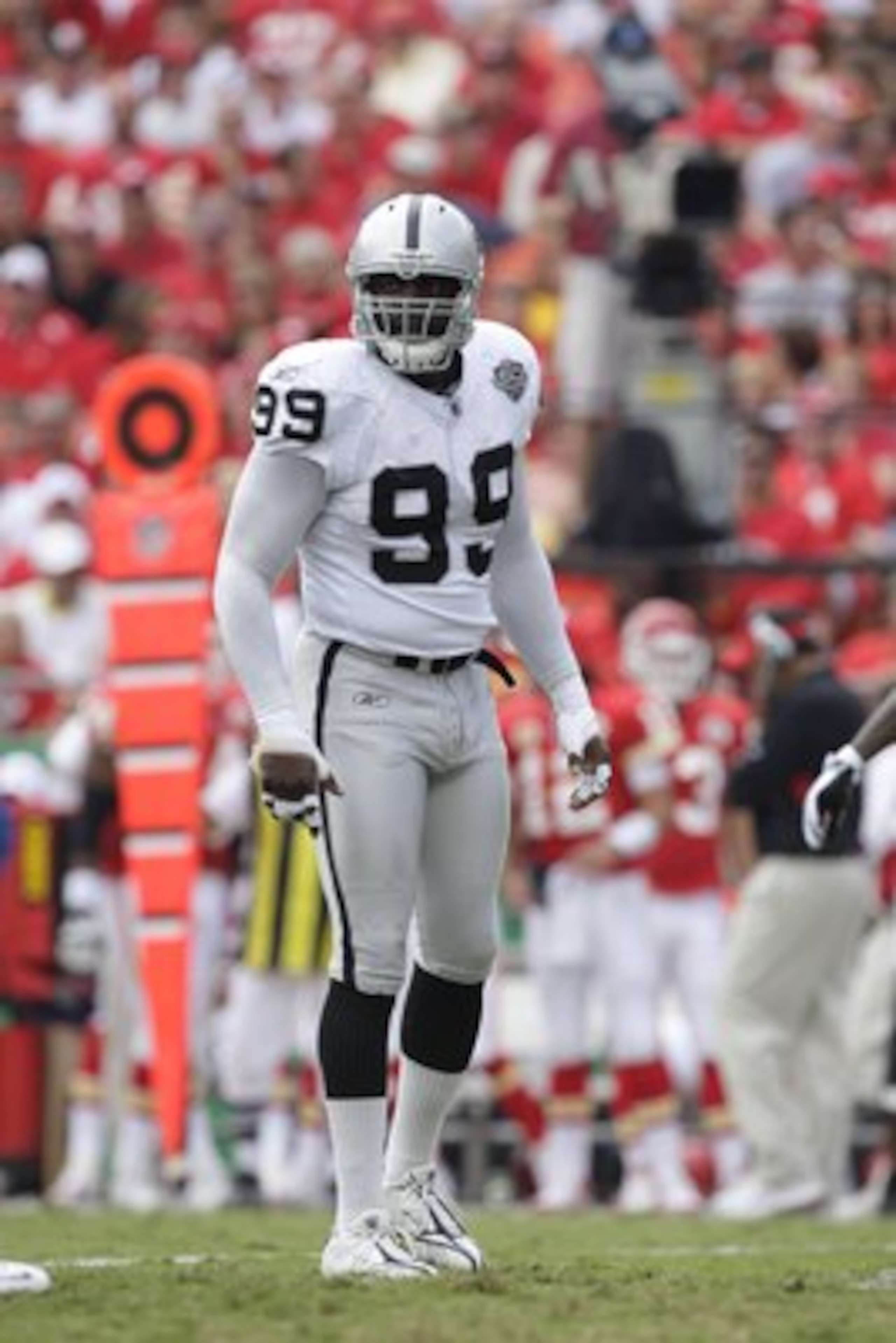 KANSAS CITY, MO - SEPTEMBER 20:  Greg Ellis #99 of the Oakland Raiders looks on during the game against the Kansas City Chiefs at Arrowhead Stadium on September 20, 2009 in Kansas City, Missouri. (Photo by Jamie Squire/Getty Images)