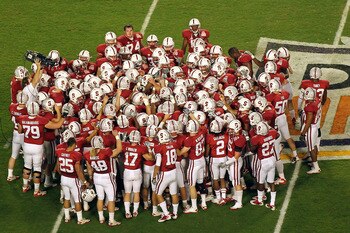 MIAMI, FL - JANUARY 03:  The Stanford Cardinal huddle on the field prior to playing against the Virginia Tech Hokies during the 2011 Discover Orange Bowl at Sun Life Stadium on January 3, 2011 in Miami, Florida. Stanford won 40-12. (Photo by Mike Ehrmann/