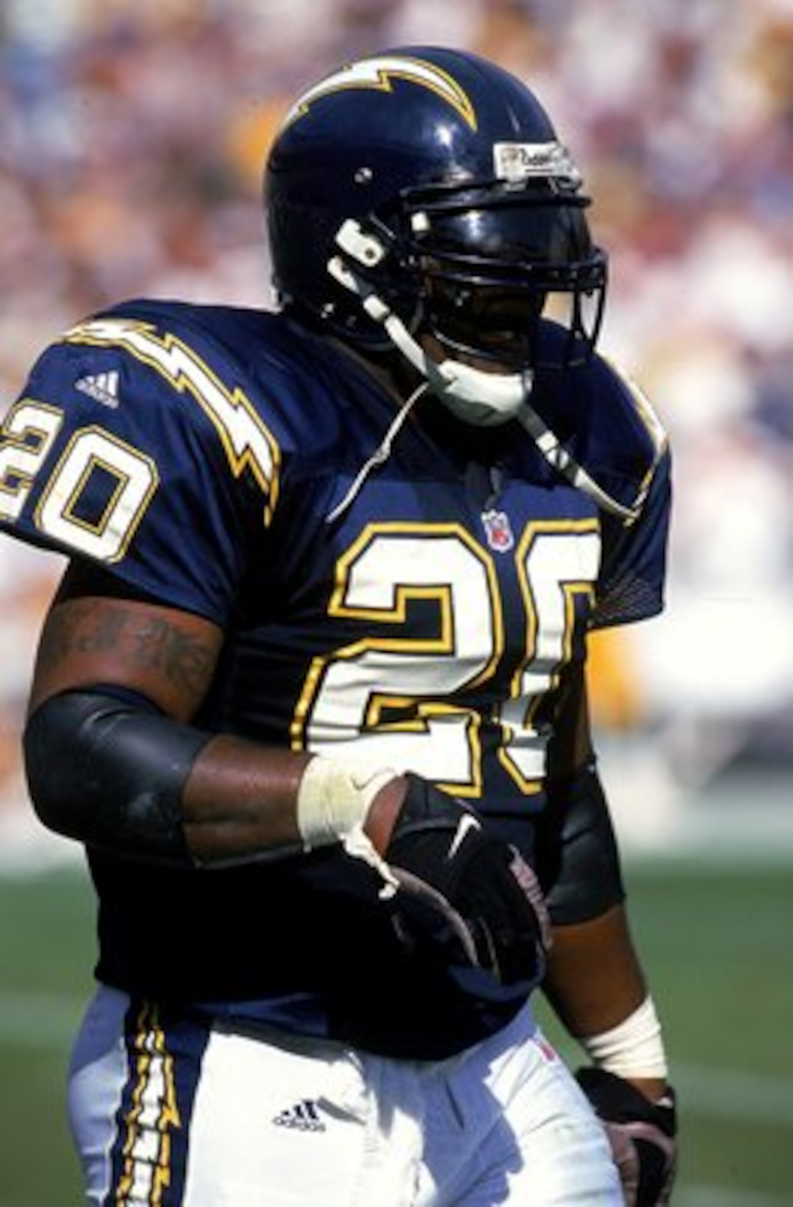 24 Oct 1999: Natrone Means #20 of the San Diego Chargers walks on the field during the game against the Green Bay Packers at Qualcomm Stadium San Diego, California. The Packers defeated the Chargers 31-3.