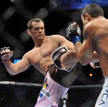 DALLAS - SEPTEMBER 19:  UFC fighter Vitor Belfort (R) battles UFC fighter Rich Franklin (L) during their Catch weight bout at UFC 103: Franklin vs. Belfort at the American Airlines Center on September 19, 2009 in Dallas, Texas.  (Photo by Jon Kopaloff/Get