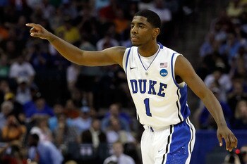 CHARLOTTE, NC - MARCH 18:  Kyrie Irving #1 of the Duke Blue Devils points in the first half while taking on the Hampton Pirates during the second round of the 2011 NCAA men's basketball tournament at Time Warner Cable Arena on March 18, 2011 in Charlotte,