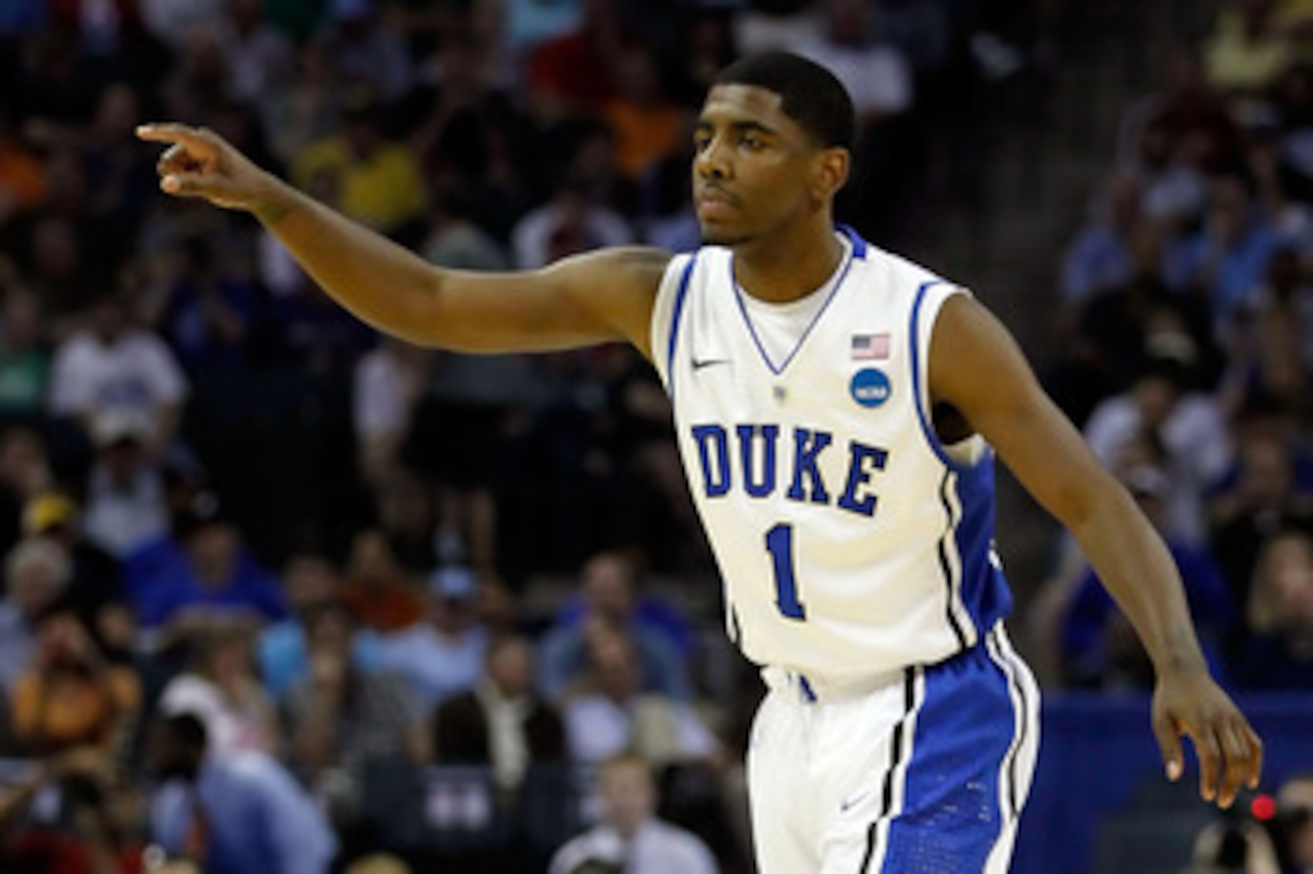 CHARLOTTE, NC - MARCH 18: Kyrie Irving #1 of the Duke Blue Devils points in the first half while taking on the Hampton Pirates during the second round of the 2011 NCAA men's basketball tournament at Time Warner Cable Arena on March 18, 2011 in Charlotte, CHARLOTTE, NC - MARCH 18: Kyrie Irving #1 of the Duke Blue Devils points in the first half while taking on the Hampton Pirates during the second round of the 2011 NCAA men's basketball tournament at Time Warner Cable Arena on March 18, 2011 in Charlotte,