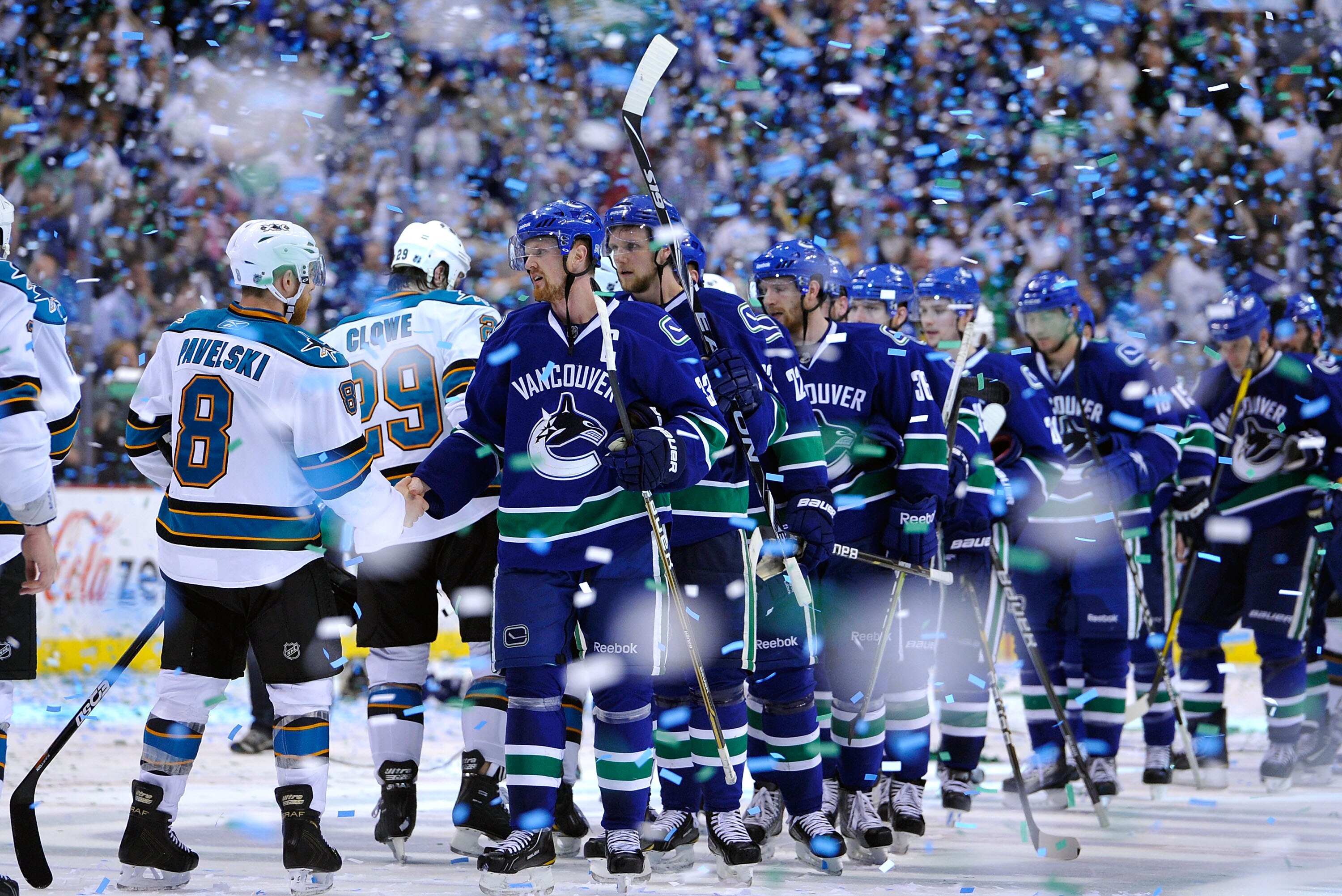 VANCOUVER, BC - MAY 24:  Captain Henrik Sedin #33 of the Vancouver Canucks shakes hands with Joe Pavelski #8 of the San Jose Sharks after the Vancouver Canucks won Game Five of the Western Conference Finals 3-2 in the second overtime to win the series 4-1
