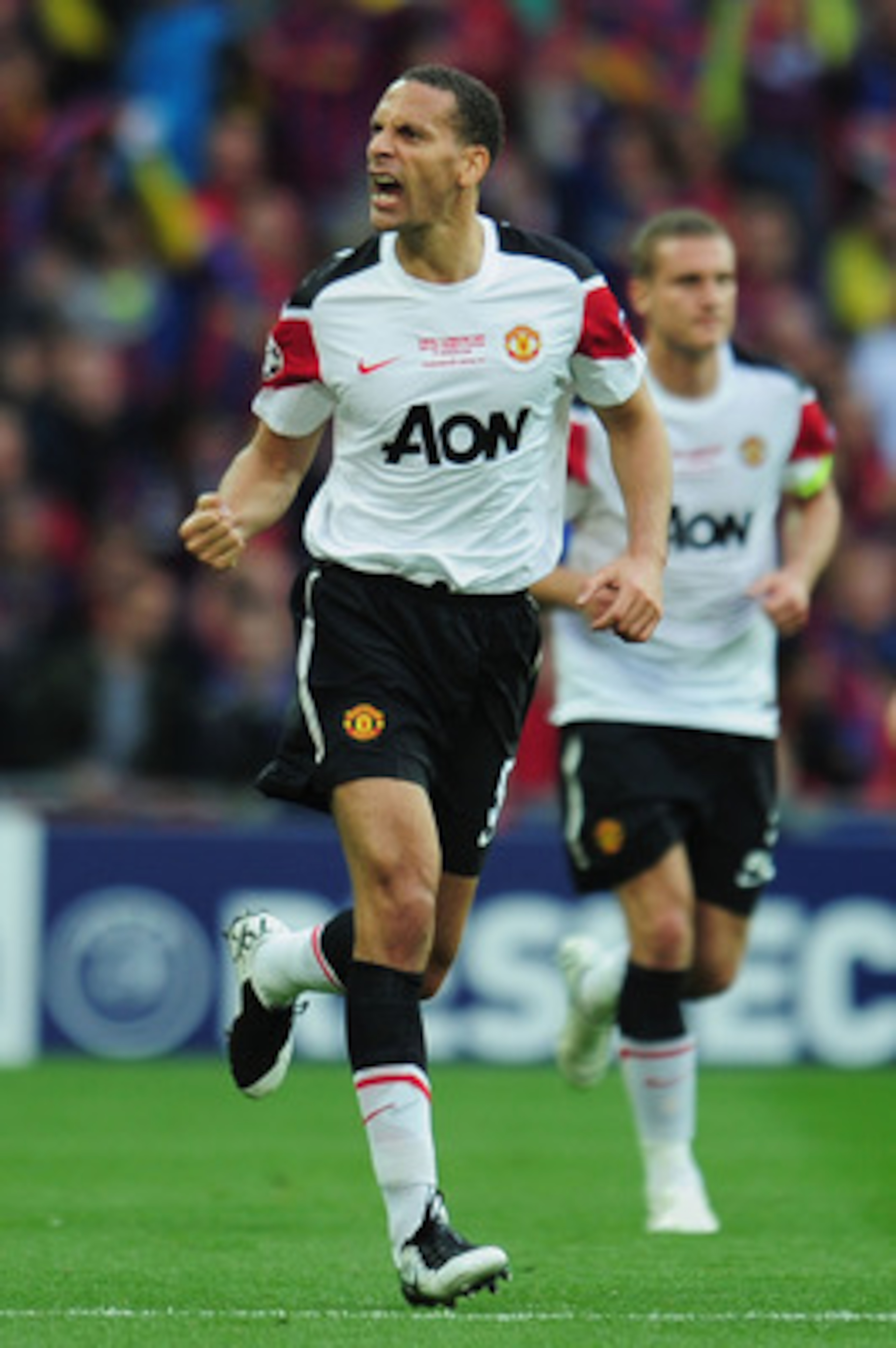 LONDON, ENGLAND - MAY 28: Rio Ferdinand of Manchester United celebrates as teammate Wayne Rooney (not pictured) scores the equalising goal during the UEFA Champions League final between FC Barcelona and Manchester United FC at Wembley Stadium on May 28, LONDON, ENGLAND - MAY 28: Rio Ferdinand of Manchester United celebrates as teammate Wayne Rooney (not pictured) scores the equalising goal during the UEFA Champions League final between FC Barcelona and Manchester United FC at Wembley Stadium on May 28,