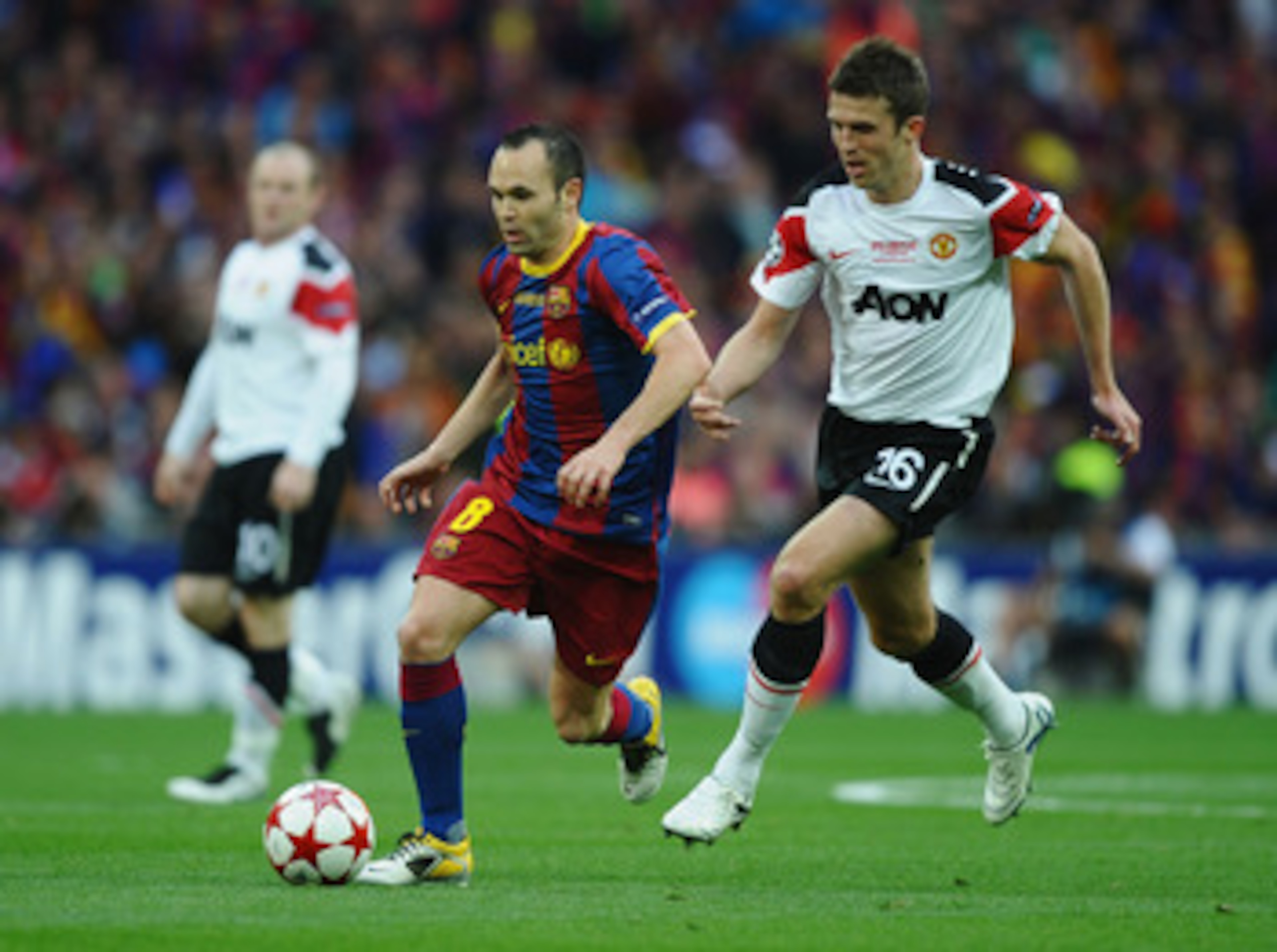 LONDON, ENGLAND - MAY 28: Andres Iniesta of FC Barcelona (L) in action against Michael Carrick of Manchester United during the UEFA Champions League final between FC Barcelona and Manchester United FC at Wembley Stadium on May 28, 2011 in London, England LONDON, ENGLAND - MAY 28: Andres Iniesta of FC Barcelona (L) in action against Michael Carrick of Manchester United during the UEFA Champions League final between FC Barcelona and Manchester United FC at Wembley Stadium on May 28, 2011 in London, England