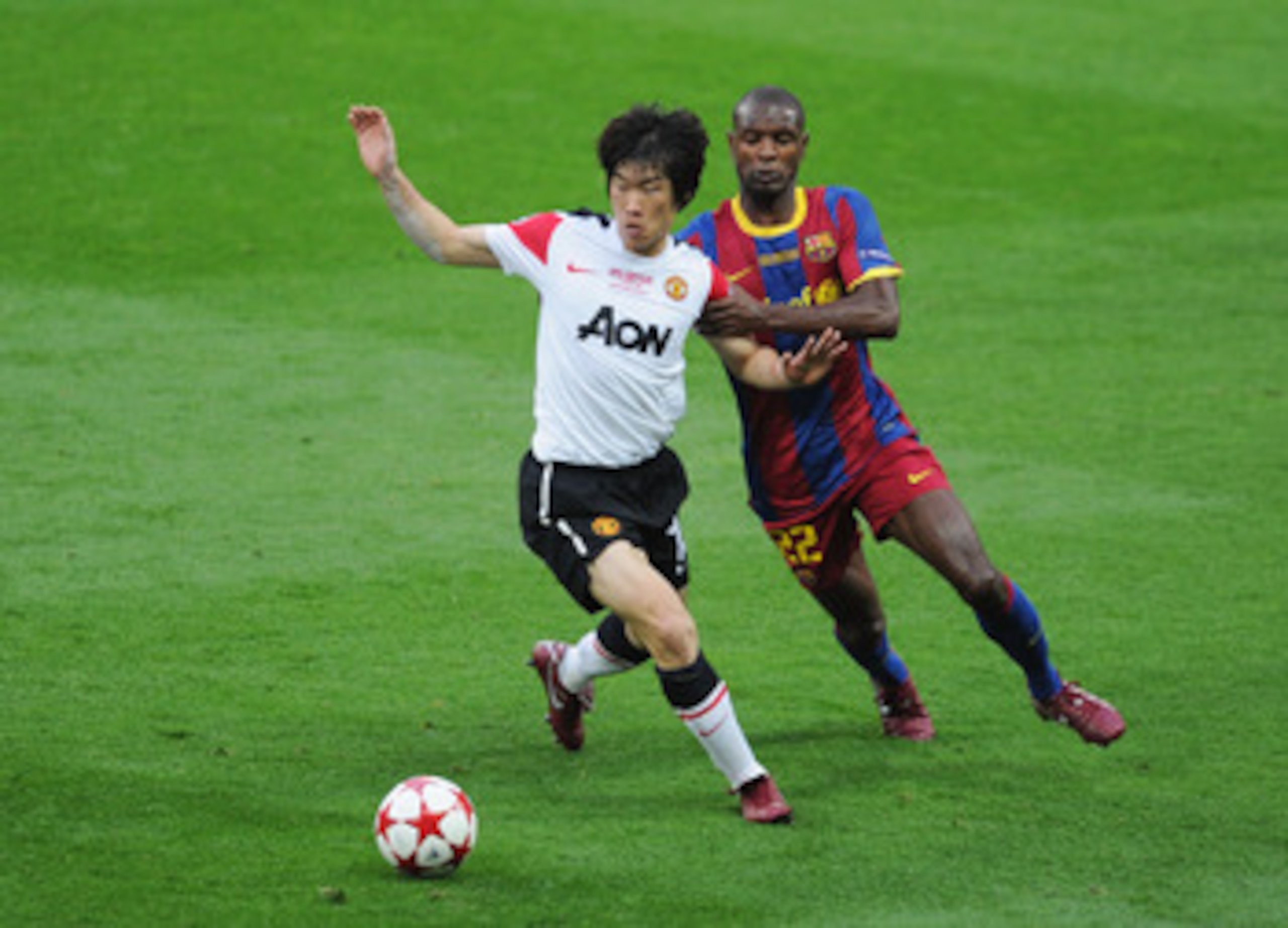 LONDON, ENGLAND - MAY 28:  Park Ji-Sung of Manchester United (L) is challenged by Eric Abidal of FC Barcelona during the UEFA Champions League final between FC Barcelona and Manchester United FC at Wembley Stadium on May 28, 2011 in London, England.  (Pho
