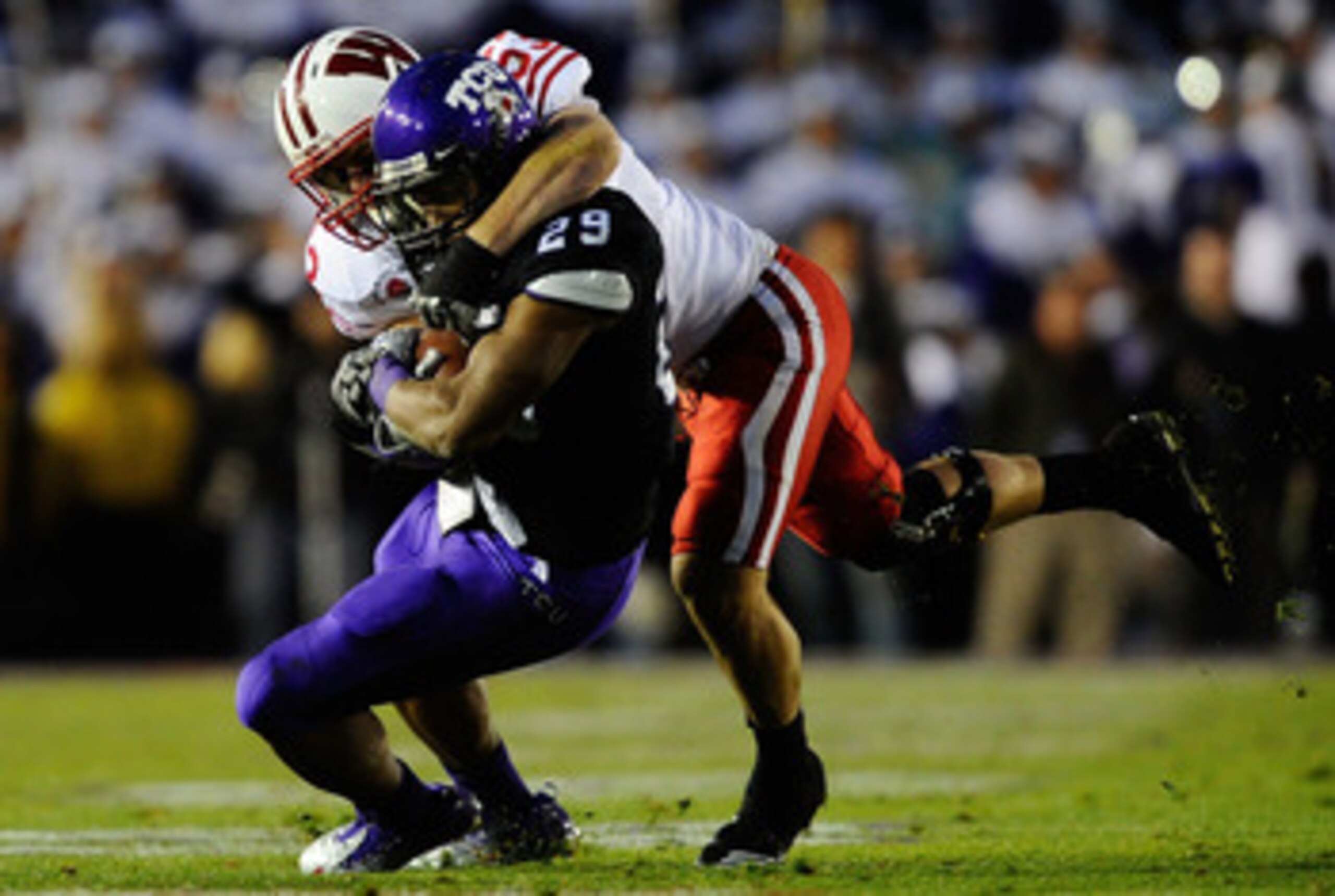 PASADENA, CA - JANUARY 01:  Tailback Matthew Tucker #29 of the TCU Horned Frogs rushes with the ball against the Wisconsin Badgers during the 97th Rose Bowl game on January 1, 2011 in Pasadena, California.  (Photo by Kevork Djansezian/Getty Images)