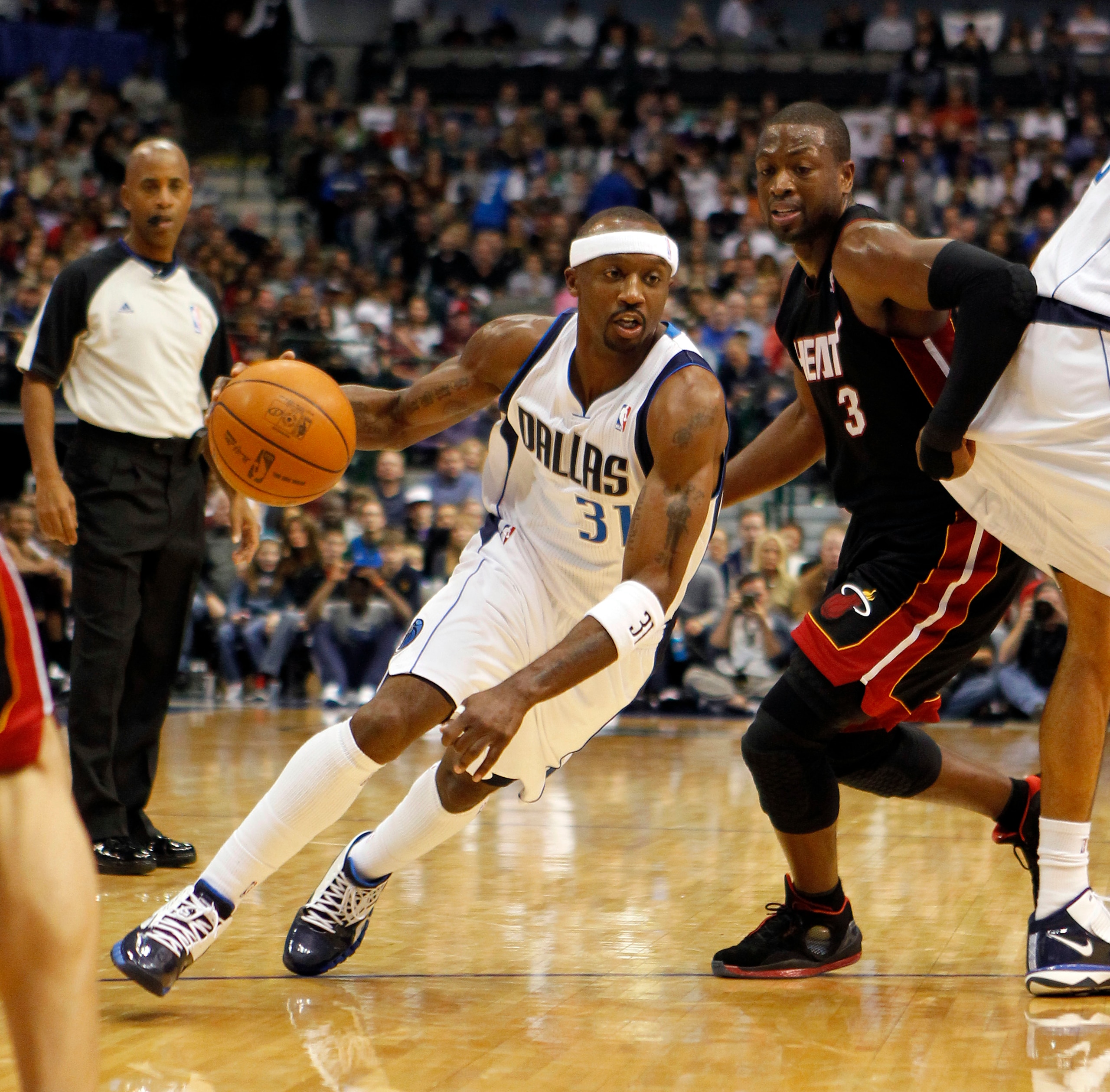 DALLAS - NOVEMBER 27: Jason Terry #31 of the Dallas Mavericks drives by Dwyane Wade #3 of the Miami Heat on November 27, 2010 at the American Airlines Center in Dallas, Texas. NOTE TO USER: User expressly acknowledges and agrees that, by downloading and o
