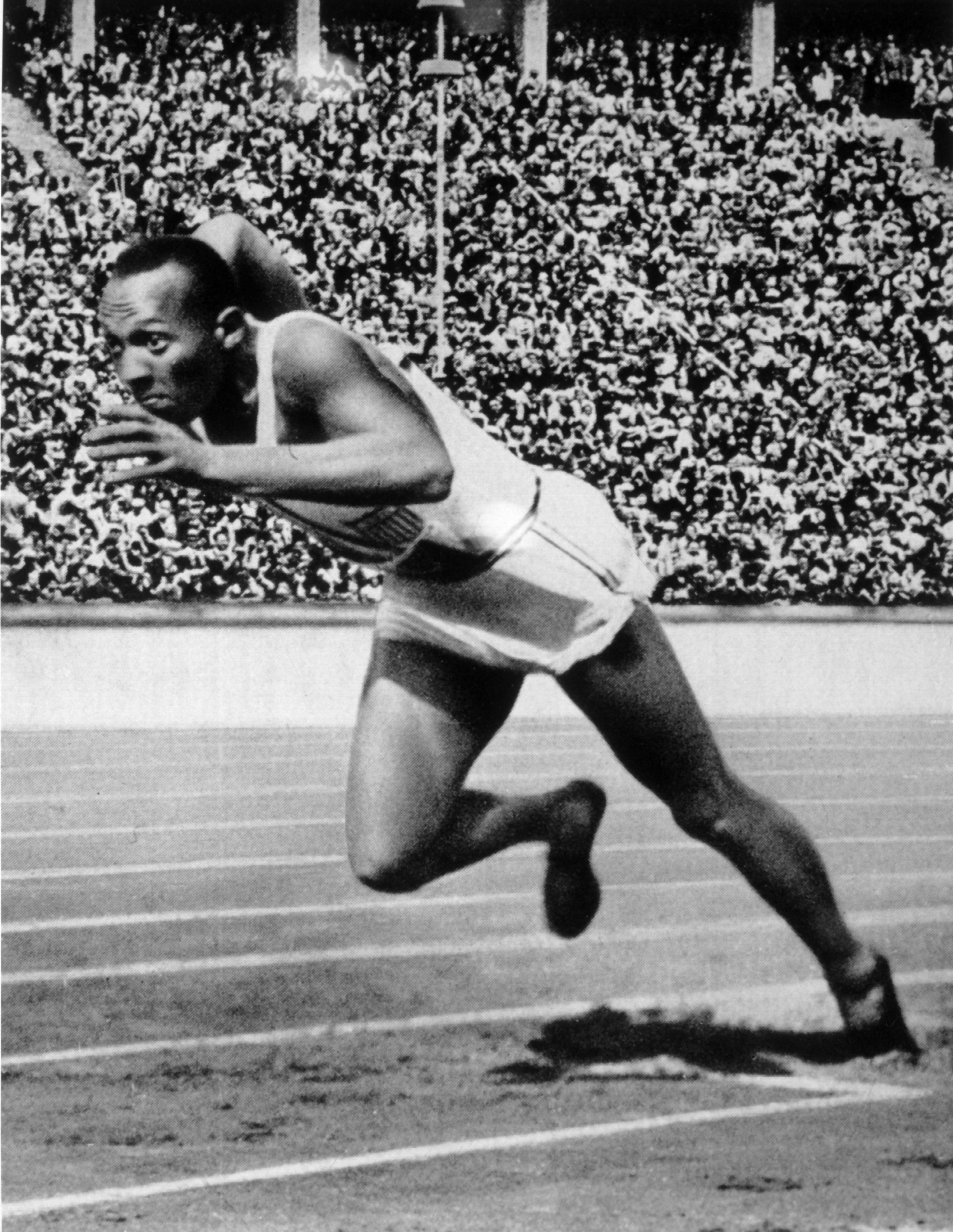 BERLIN - 1936 :  Jesse Owens of the USA in action in the mens 200m at the 1936 Summer Olympic Games held in Berlin, Germany.  Owens won a total of four gold medals in the Olympics, winning the mens 100m final, 200m final and the long jump competiton as we
