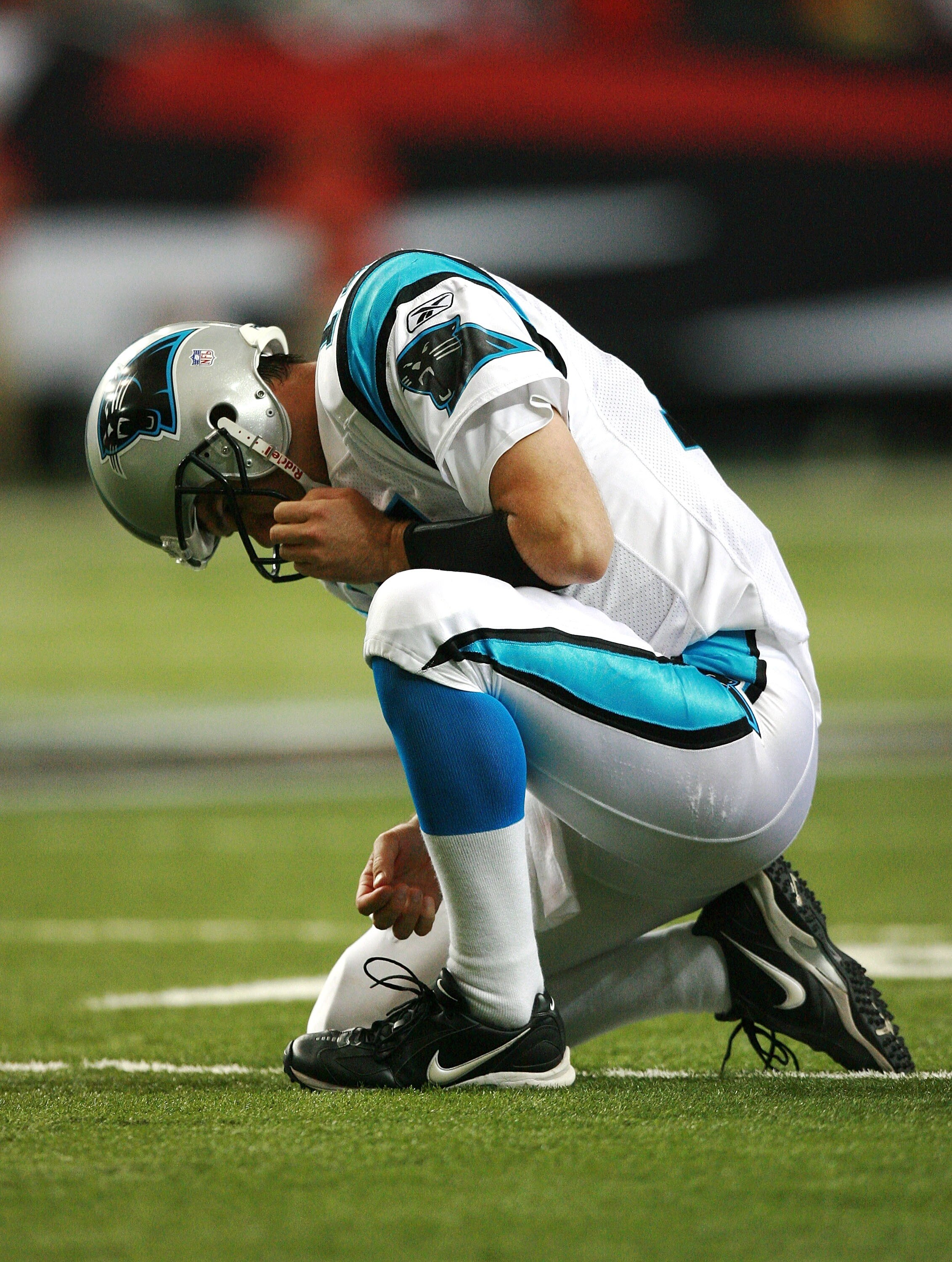 ATLANTA - SEPTEMBER 23:  Quarterback Jake Delhomme #17 of the Carolina Panthers reacts after injuring his right arm against the Atlanta Falcons at Georgia Dome September 23, 2007 in Atlanta, Georgia. The Panthers defeated the Falcons 27-20.  (Photo by Dou